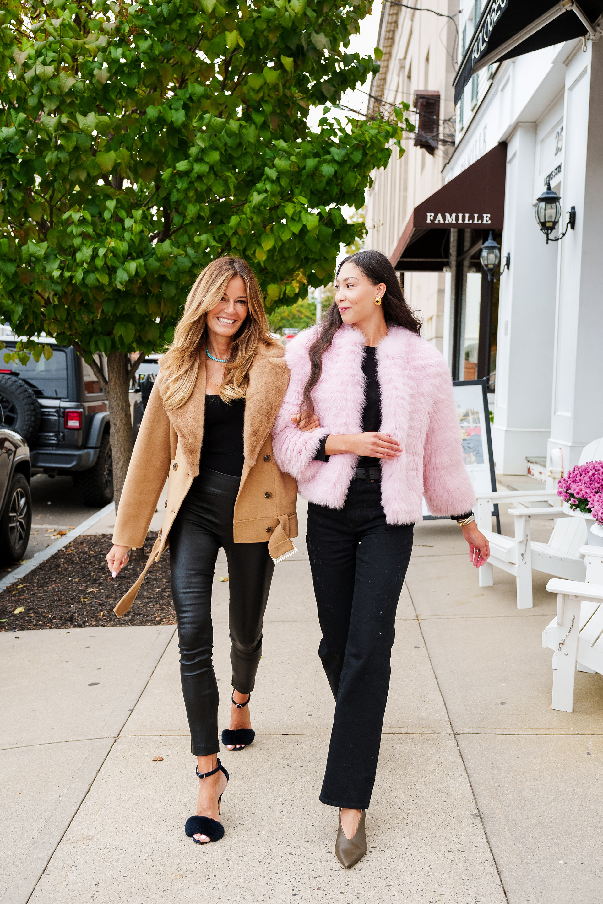 Kelly Bensimon and Greenwich influencer wearing KKB Enville Pologeorgis fur coats and walking down Lewis St