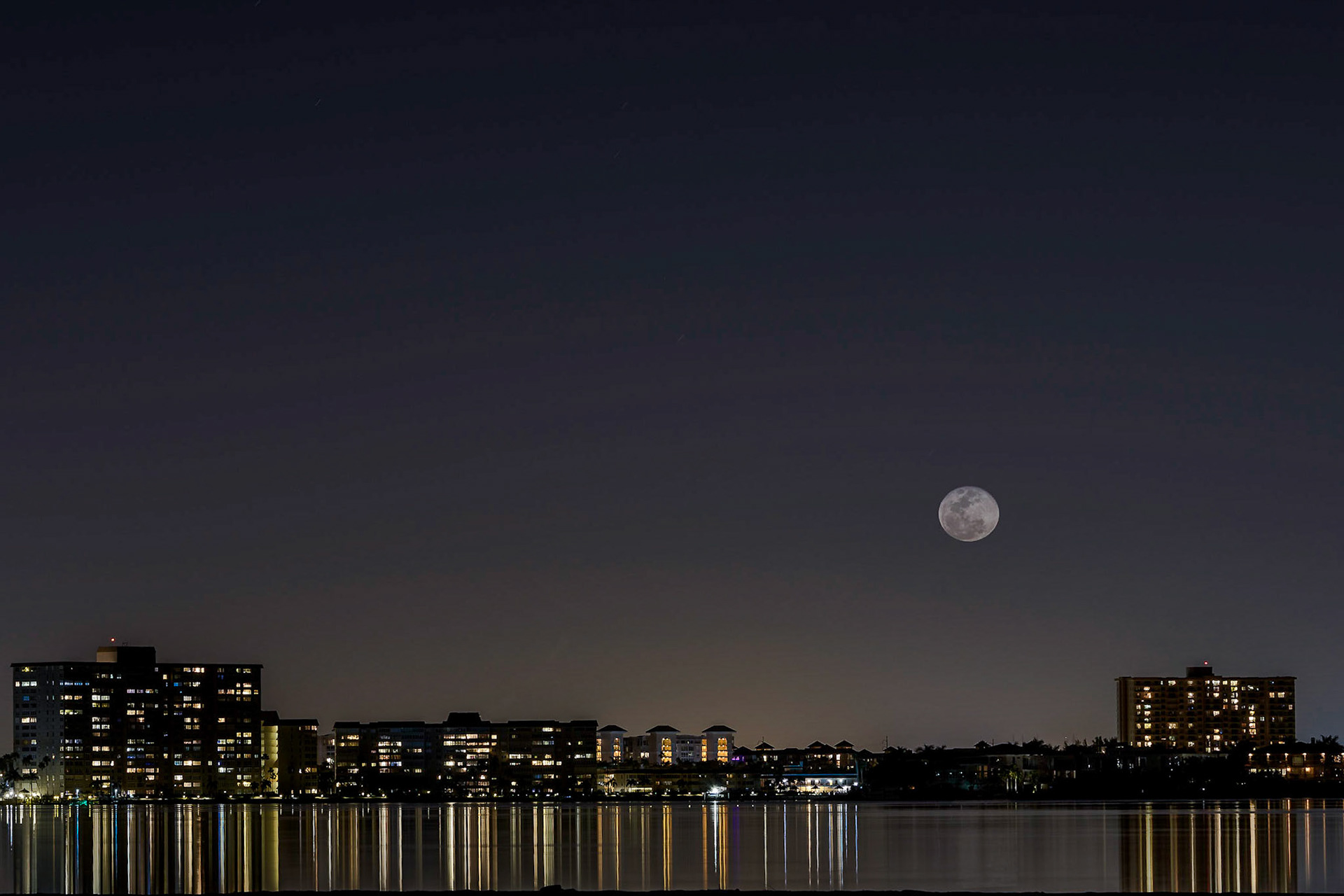 Day ofter full moon - two exposures, one for the cityscape, one for the moon - a bit of photoshop, but mostly real as I saw the sceneTierra Verde, Florida - US