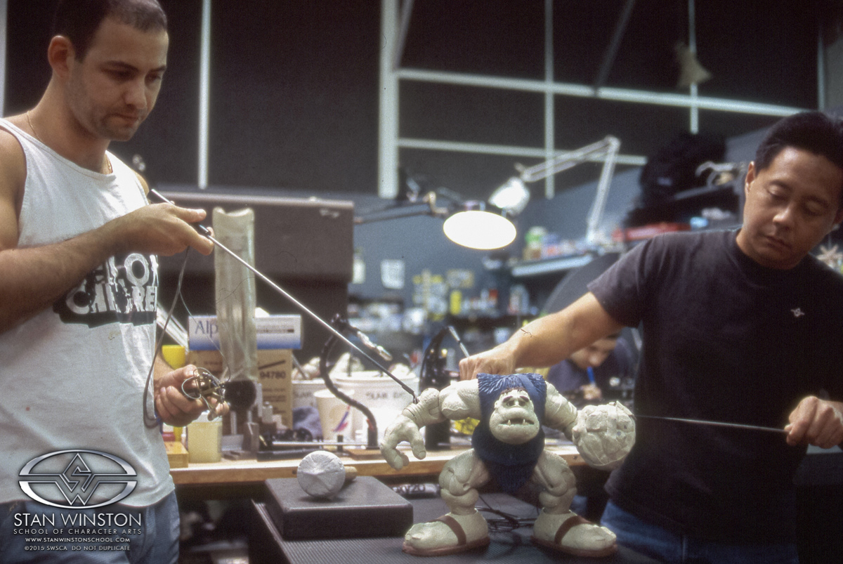 Slamfist's right arm puppet rods had a small squeeze lever to allow his wrist to bend, giving the character additional mobility and hand animation while on set.