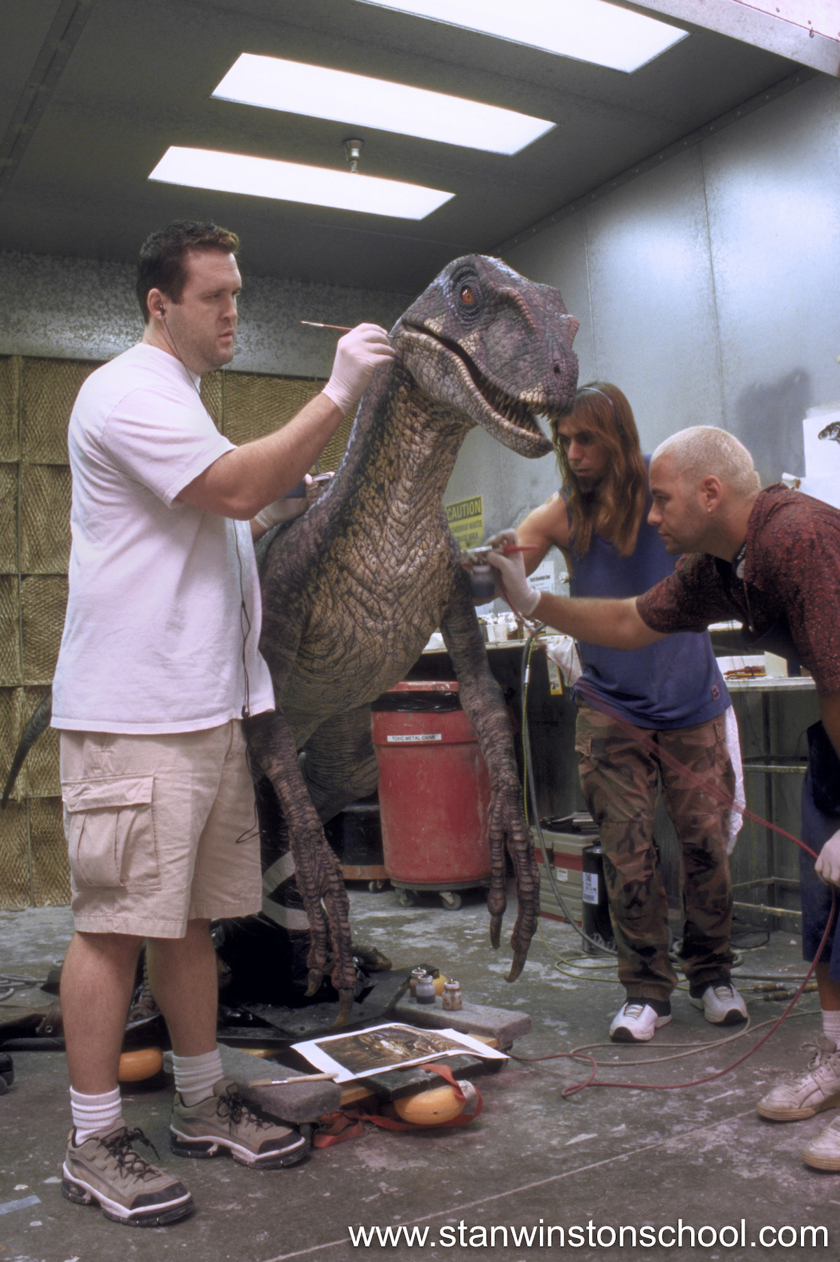 Adding the final details to the male velociraptor puppet skin.