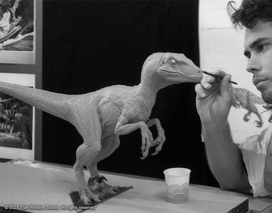 Christopher Swift sculpting the velociraptor maquette