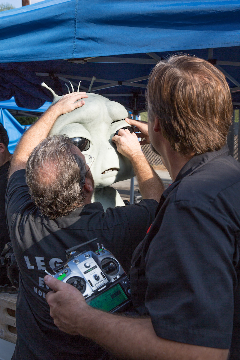 Richard Landon and Vance Hartwell adjusting the eyelid of the puppet prior to heading to set.