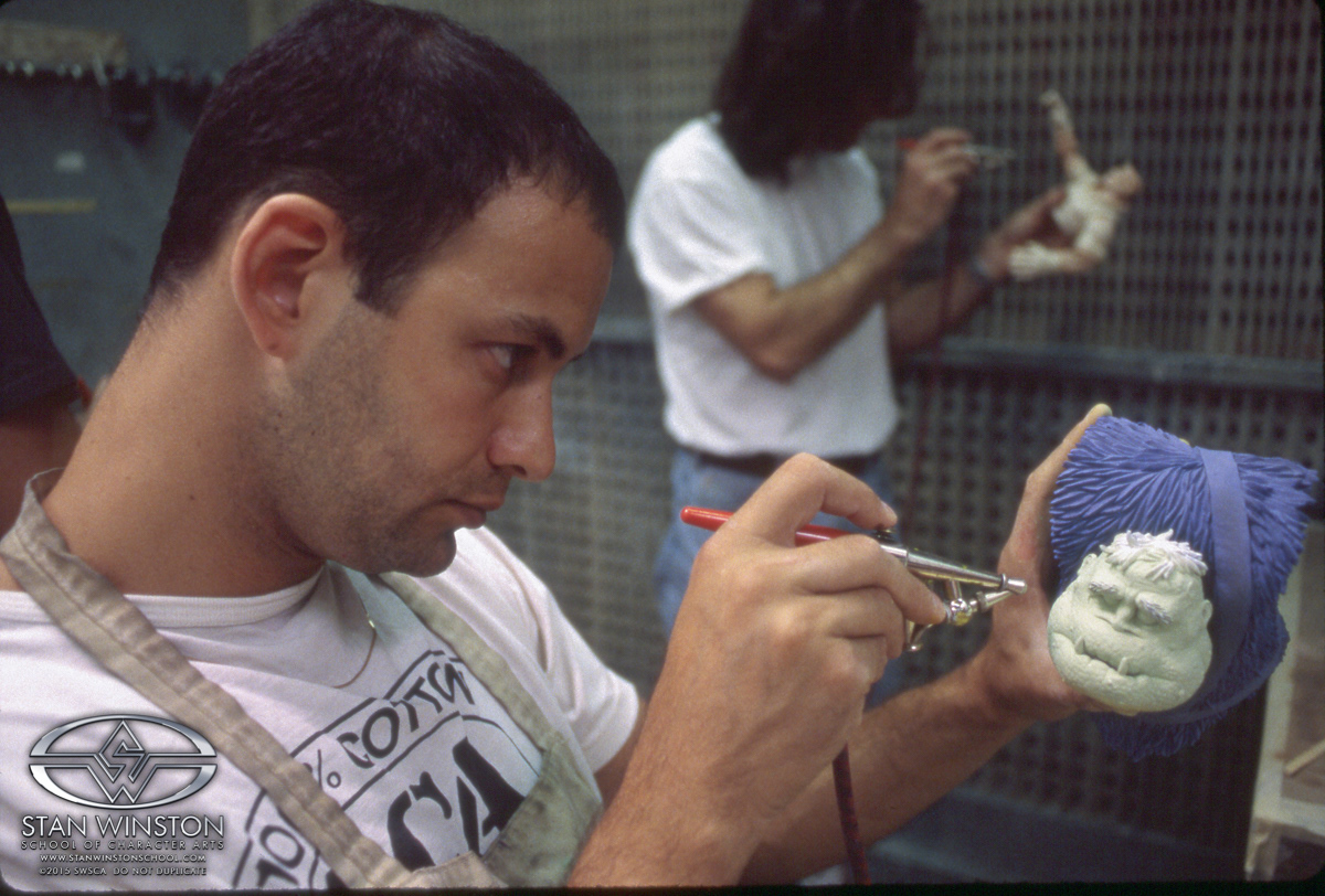 Painting the actual hollow puppet parts to be assembled on top of the mechanical interiors.