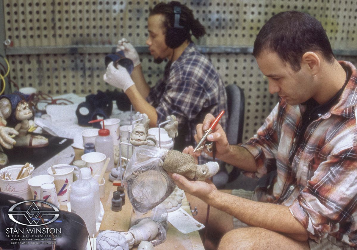 Artist Charles Ratteray was my assistant on this job. Here he paints background versions of Slamfist matching to the same original master I created at the start of this process.