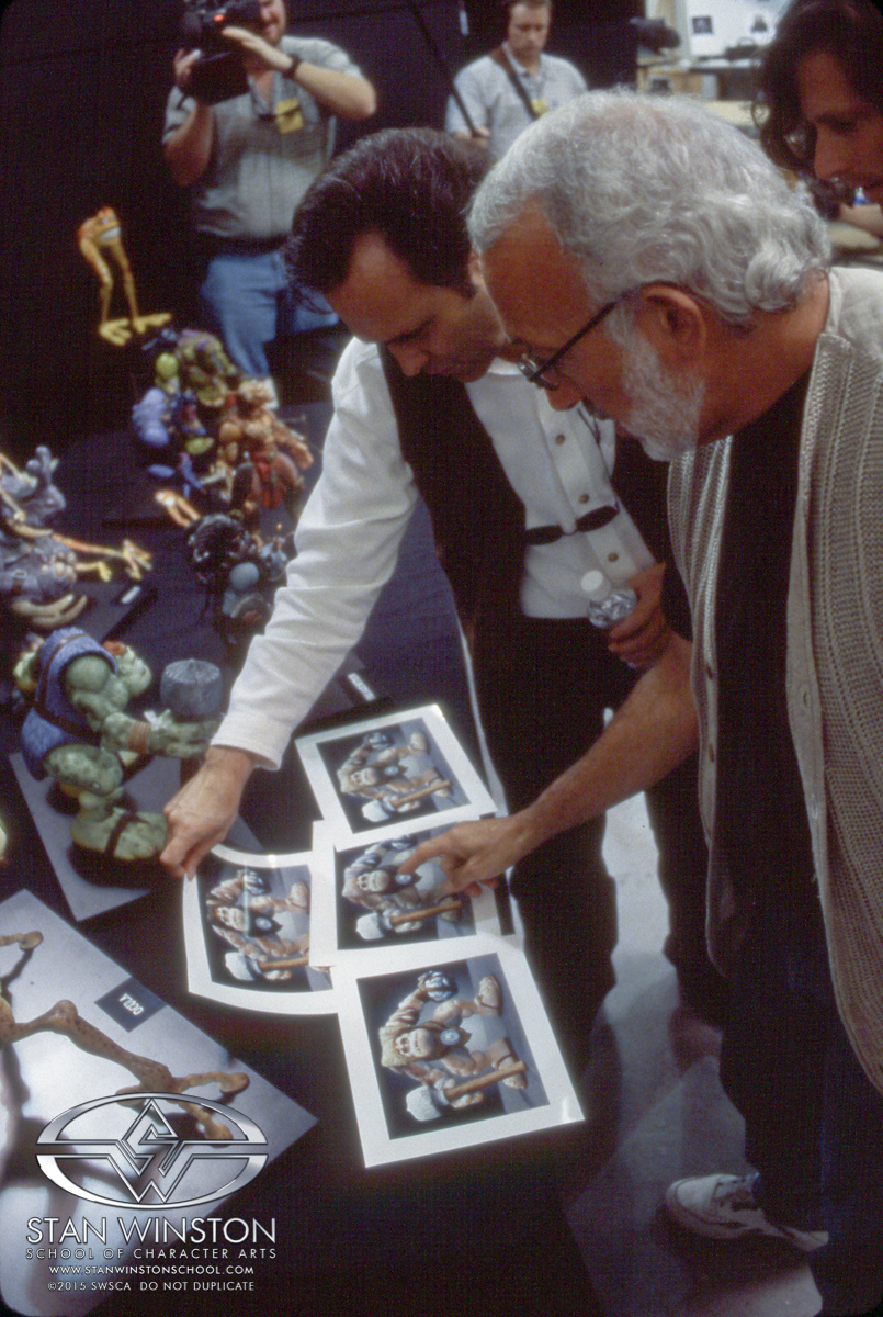 Stan discussing with Joe which color designs would be the best fit for Slamfist.