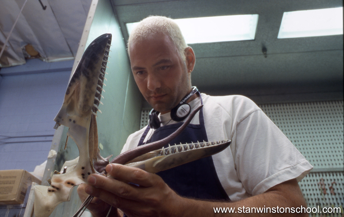 I painted the tongues and mouth palettes for the Pteranodon puppets. Here I'm securing the foam latex mouth palette into the fiberglass head shell.