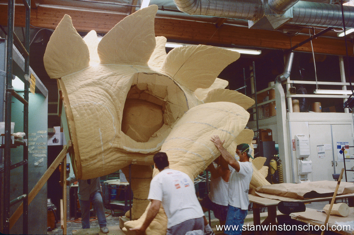 Me, Mark Maitre and Rob Ransdell moving the full sized stegosaurus left foam leg into place on the body.