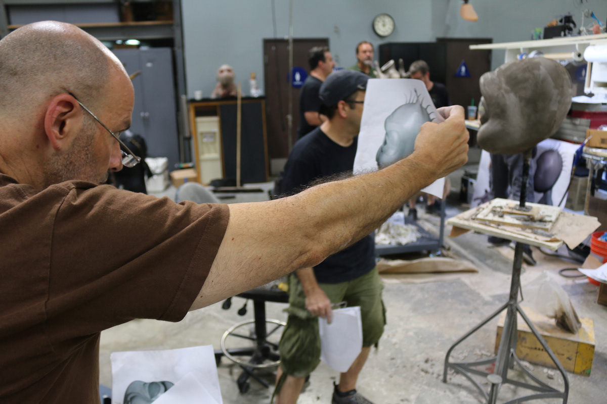 Using a profile image of the design to assure the sculpt shape was correct.