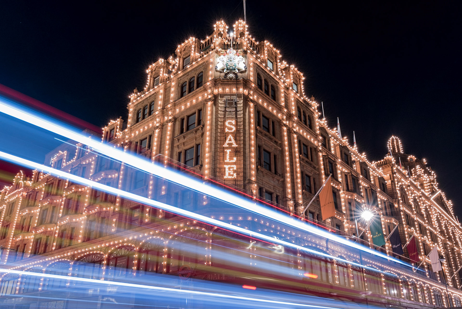 London bus passing Harrods store