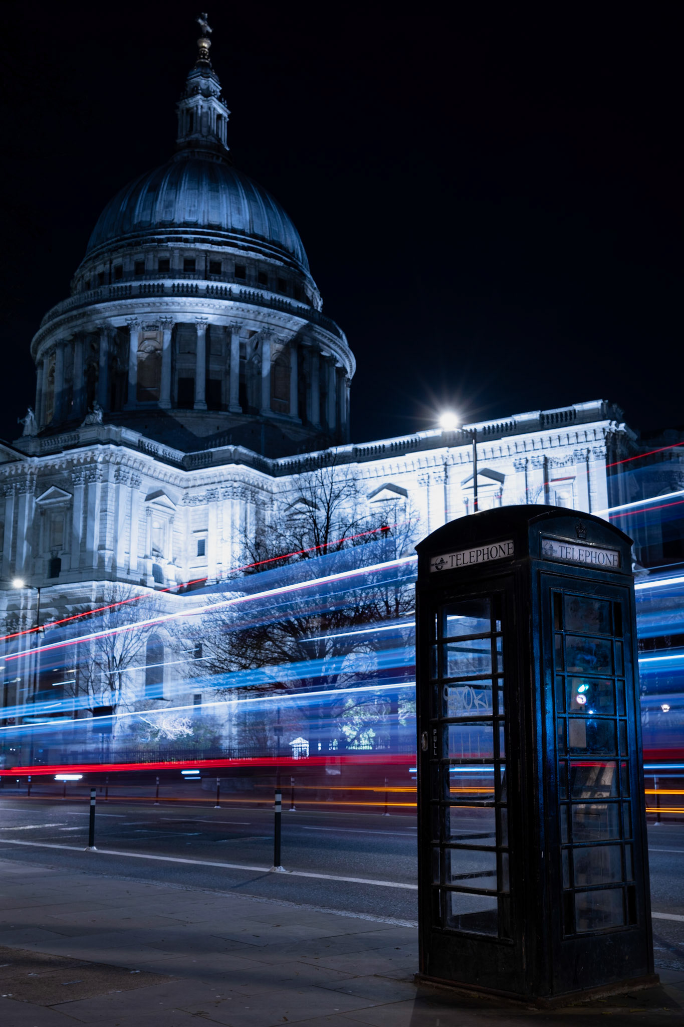 A London bus buzzing past St Paul's Cathedral