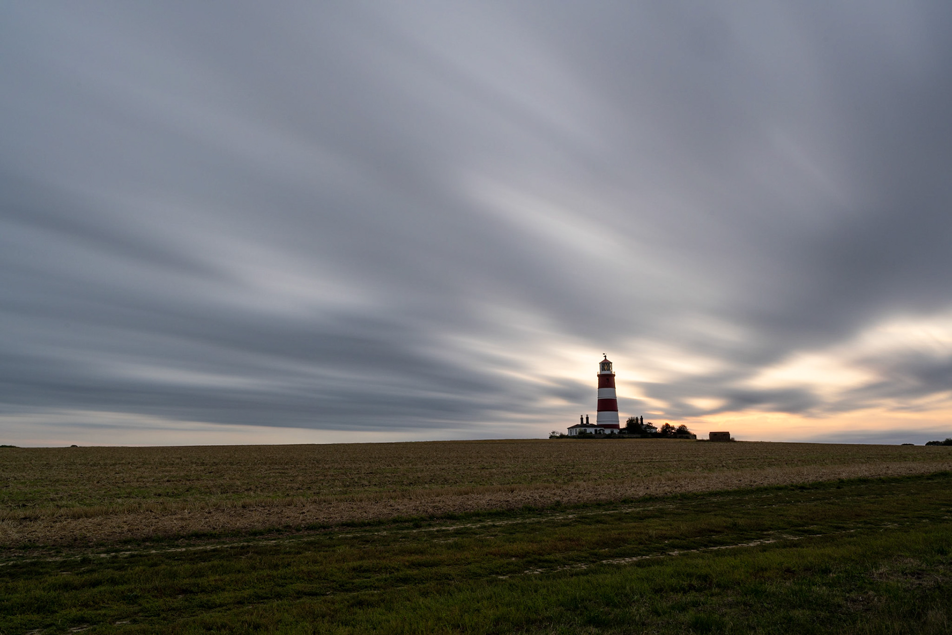 Long exposure skies across Happisburgh Lighthouse, Norfolk