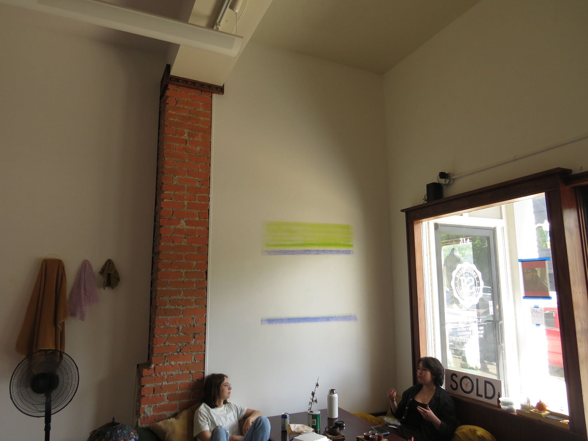 Friends sitting underneath a drawing I started during my alone time (which proved to be sparse), consisting of approximately 40,000 tally marks by the end of the show.