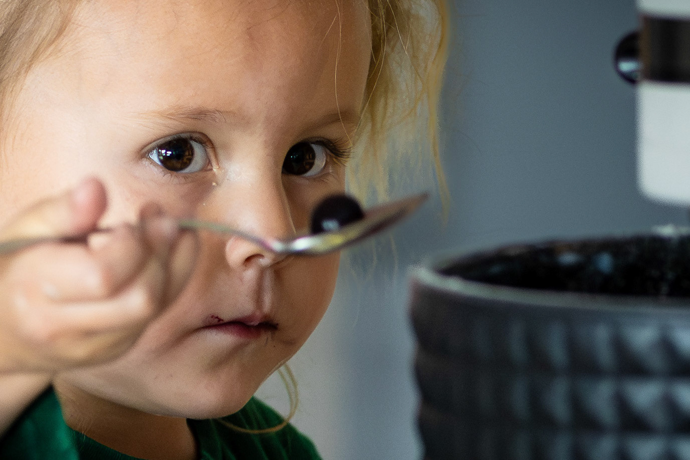 Carefully measuring the ingredients for blueberry pancakes