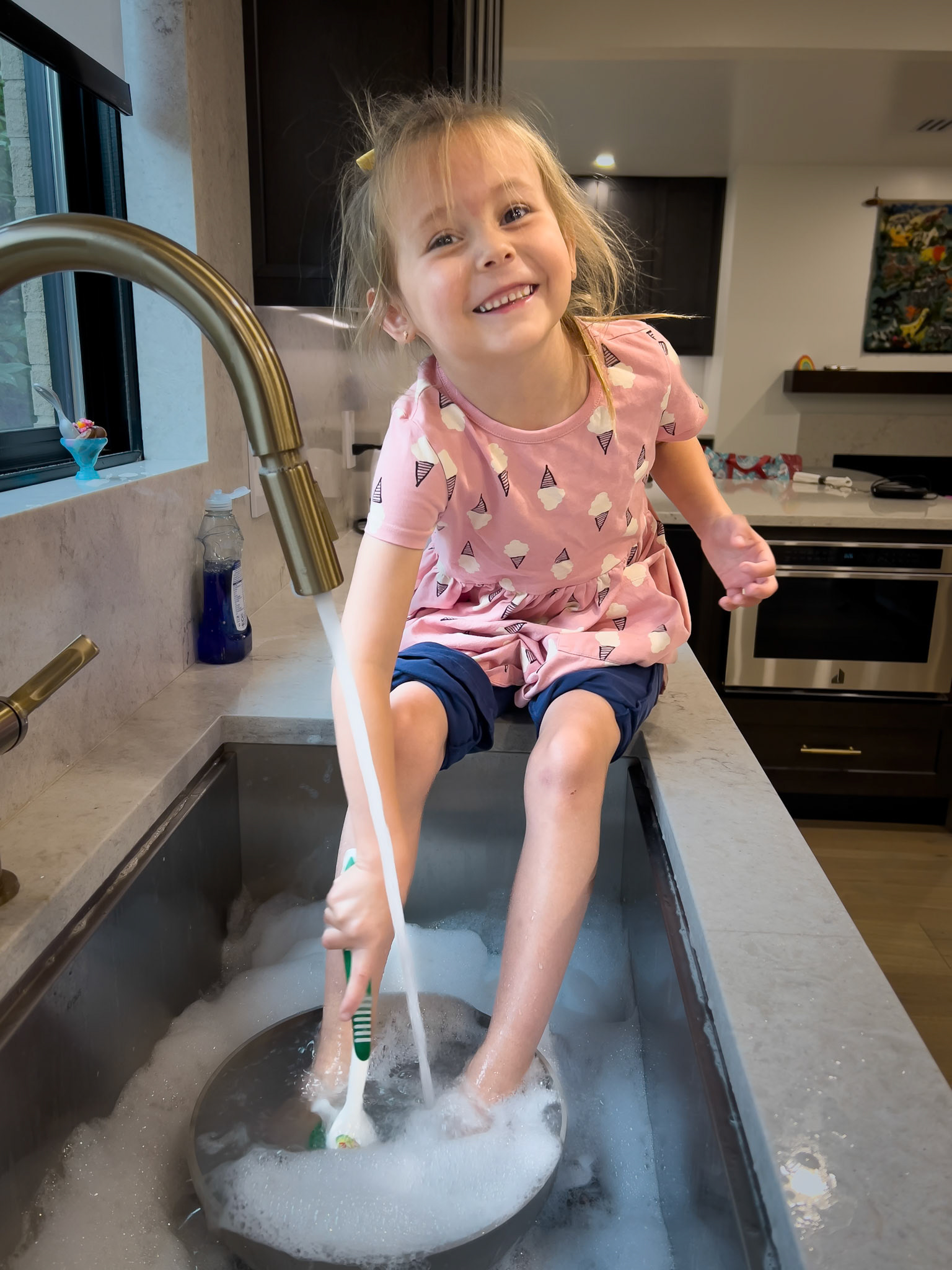 Finishing a kitchen cleanup with a little foot bath