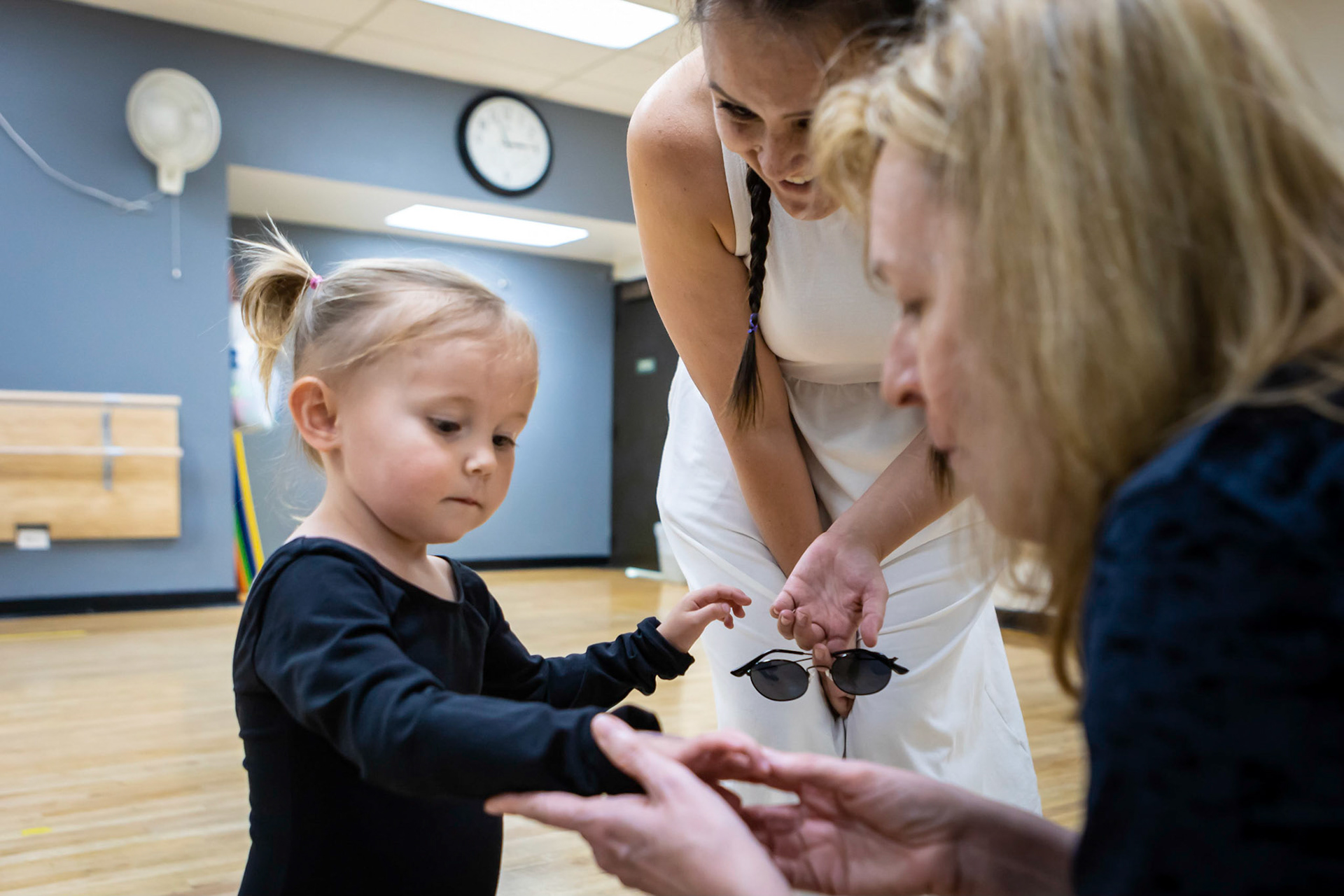 Showing off the stamps she's earned in ballet class