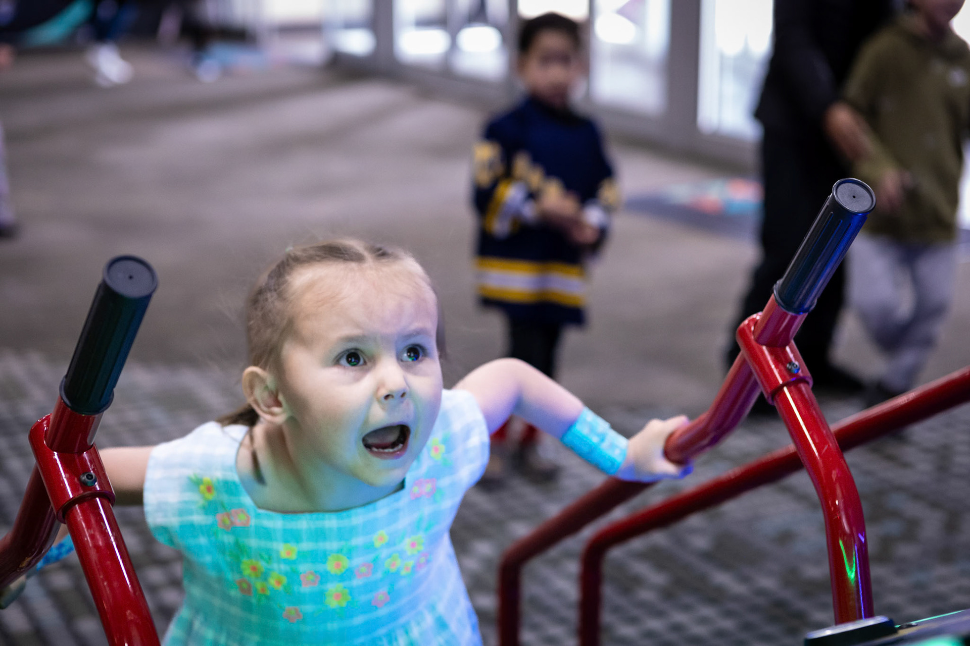 Playing the downhill ski racer game at Family Sports Center.