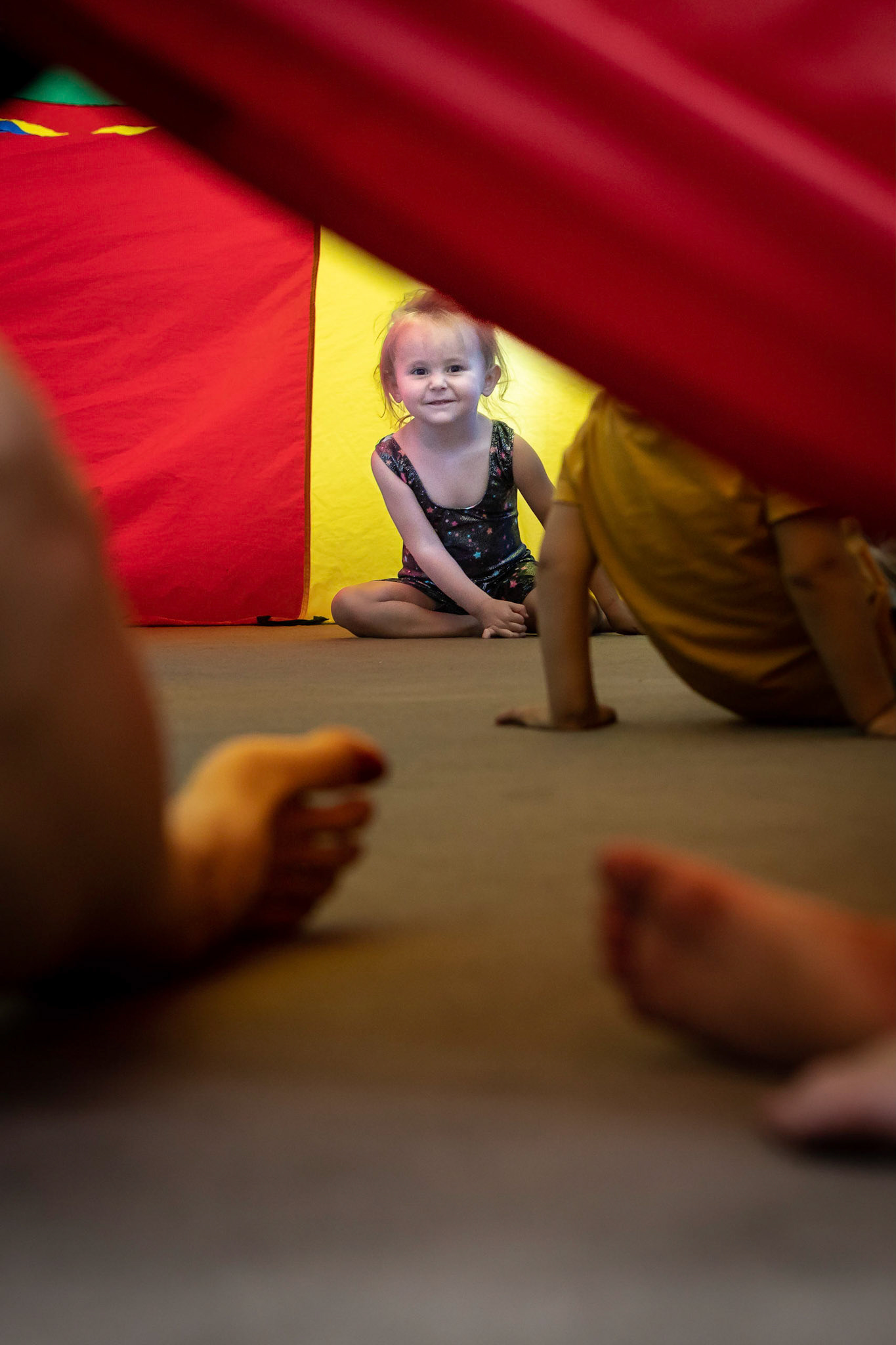 Under the parachute in gymnastics class