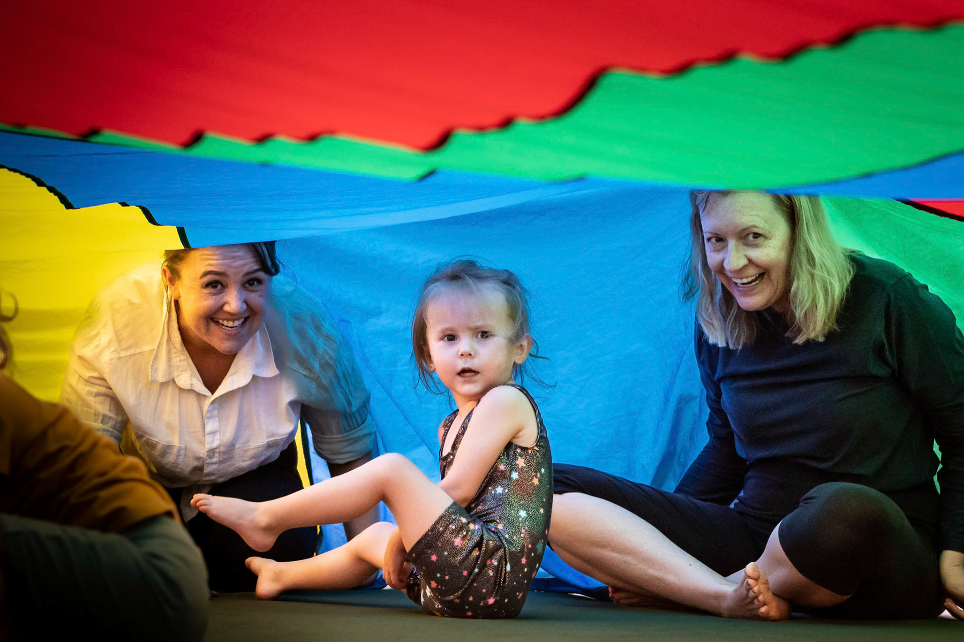 Under the parachute in gymnastics class
