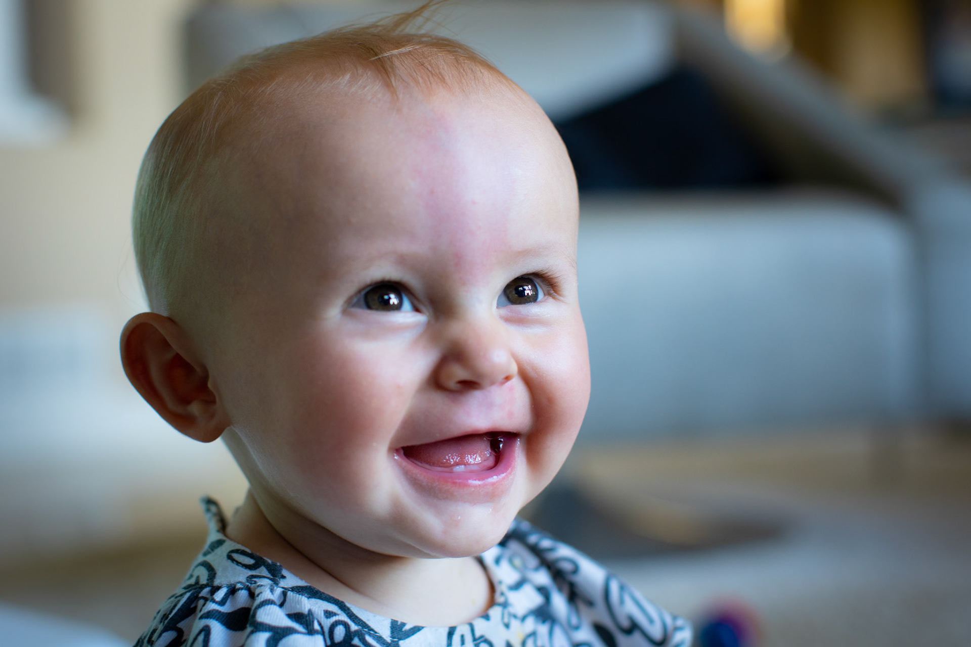 Showing off her first tooth