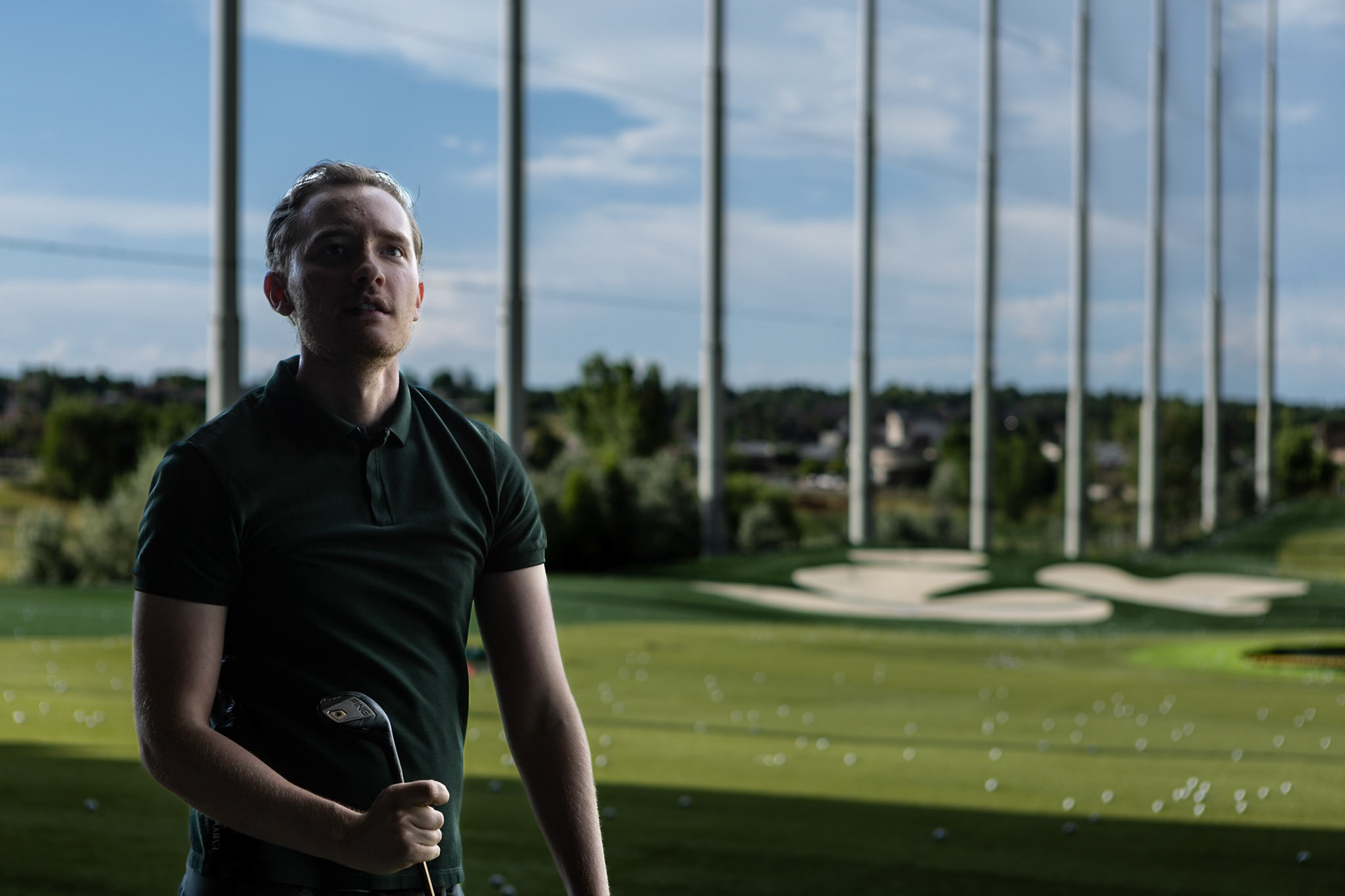 Checking the instant replay after a practice shot at Topgolf