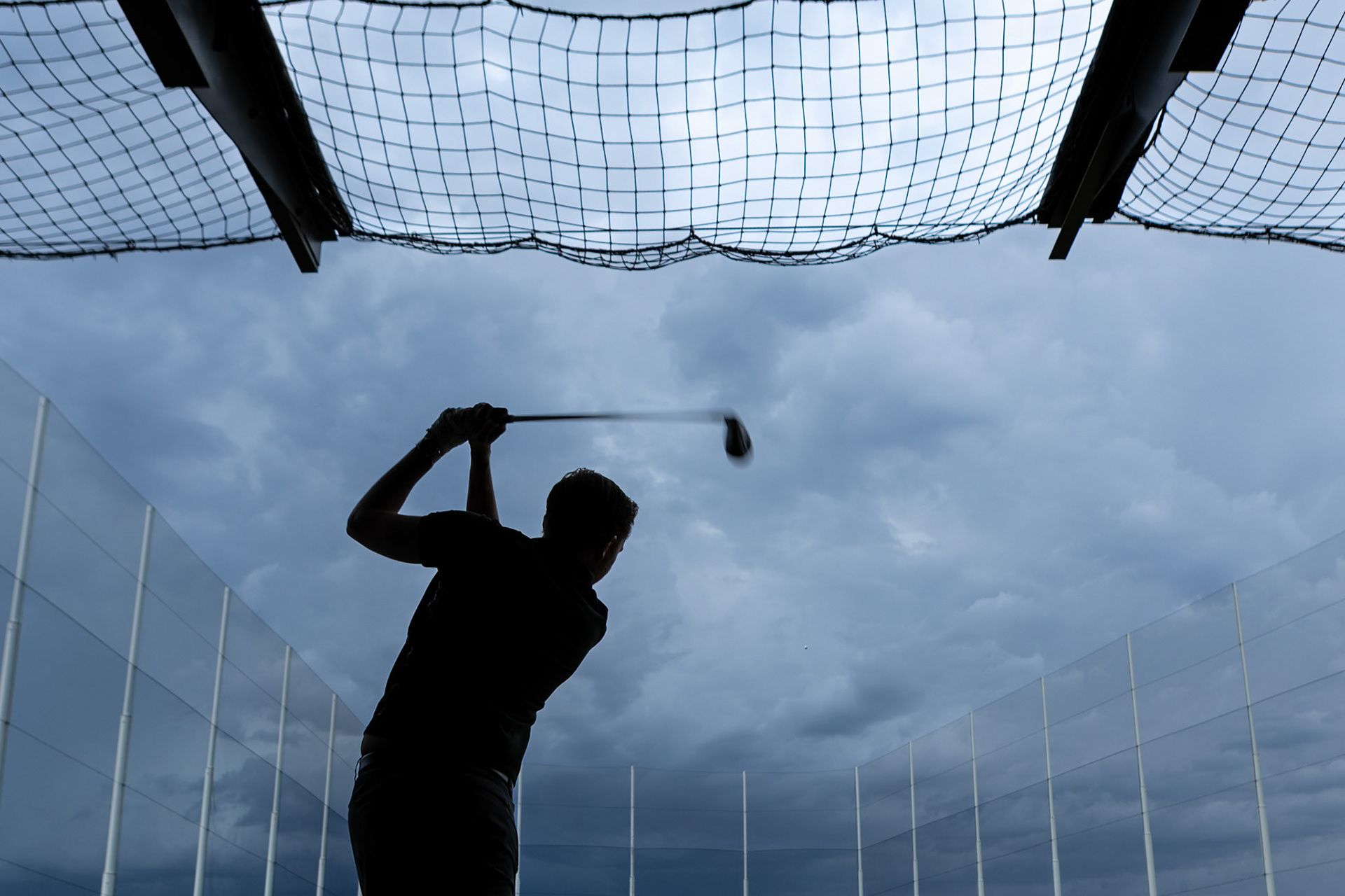 Taking some swings under stormy skies at Topgolf