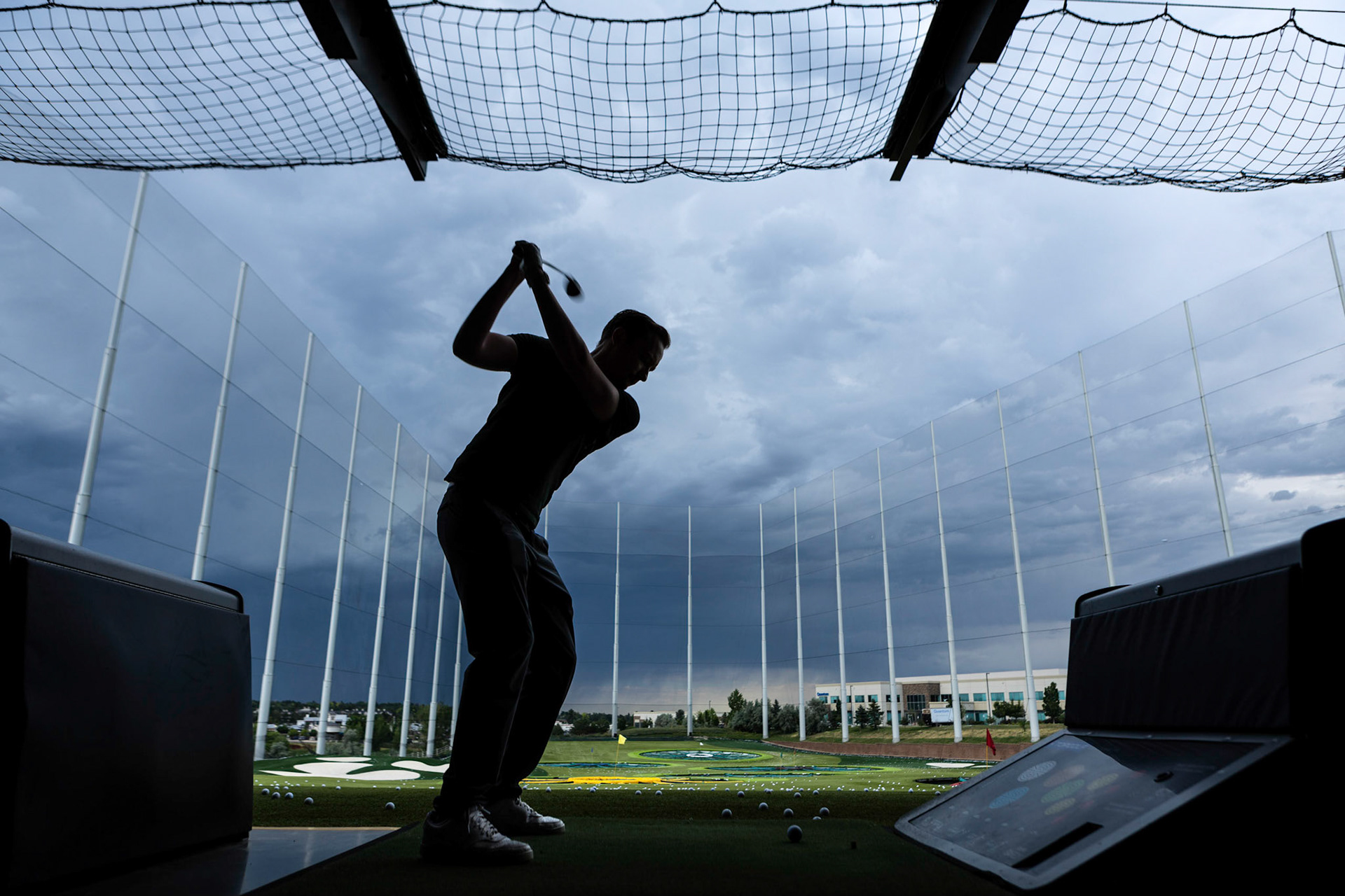 Taking some swings under stormy skies at Topgolf