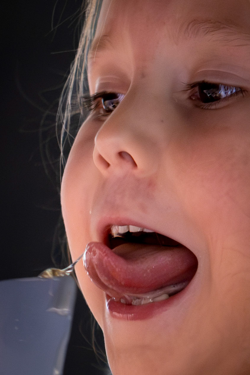 A taste of honey while preparing the ingredients for ice cream