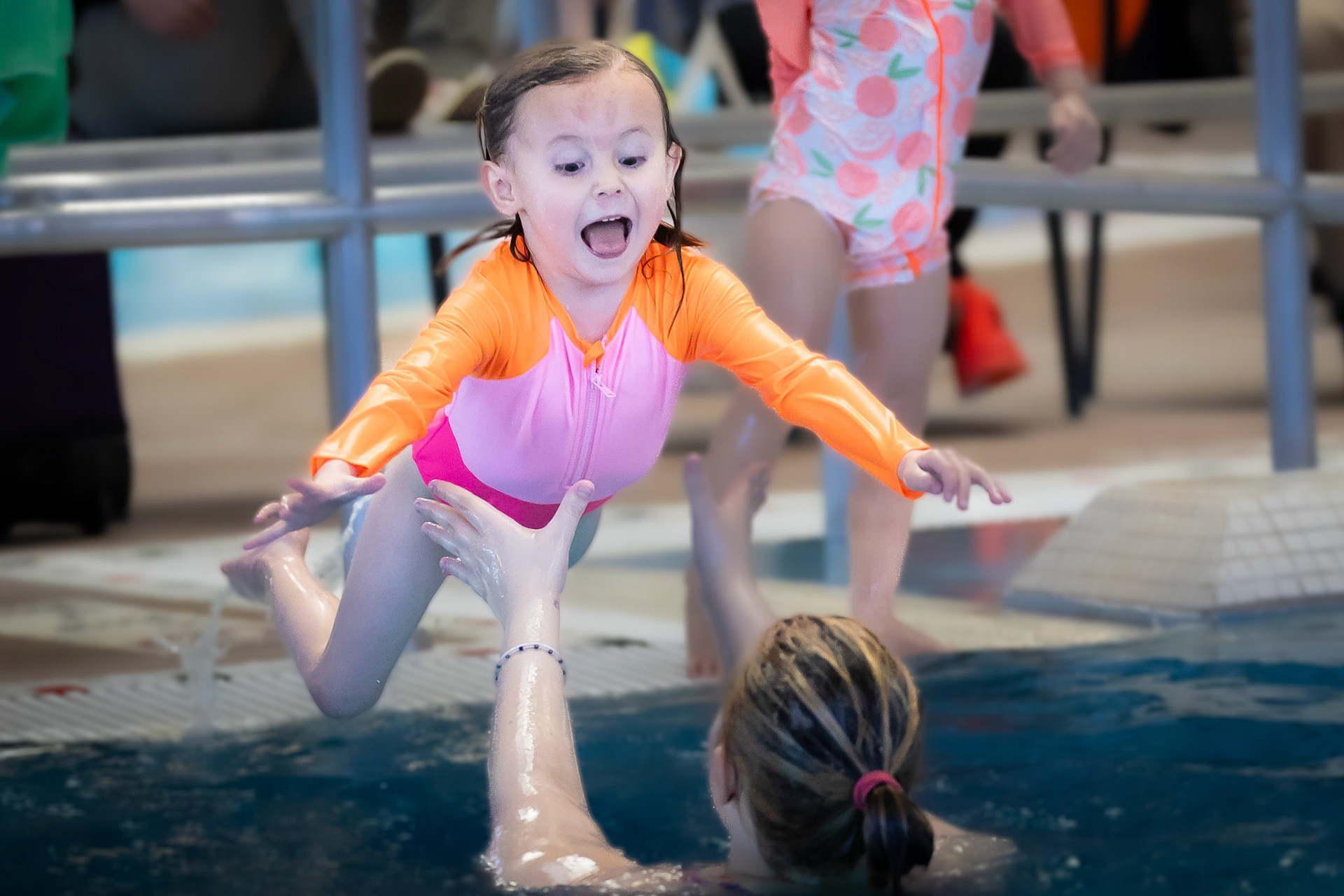 Taking the plunge during a swim lesson at Buck Recreation Center
