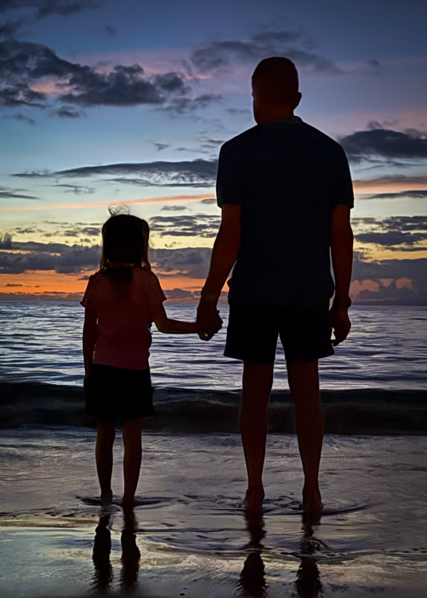 Taking in the Maui sunset with Grandpa on the beach at Grand Wailea