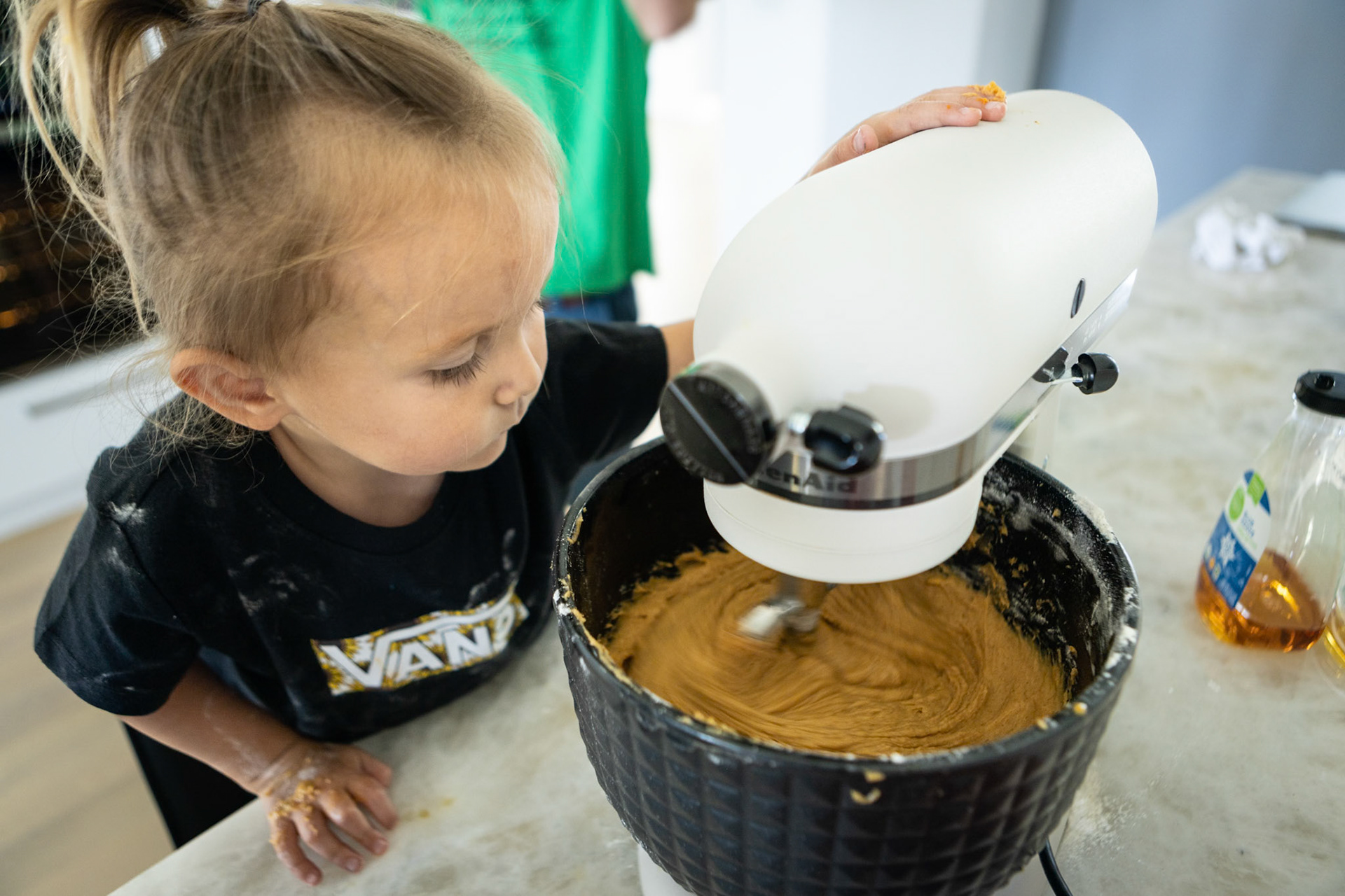 Keeping a watchful eye over the big-girl mixer while making cinnamon pumpkin bread with Grandma