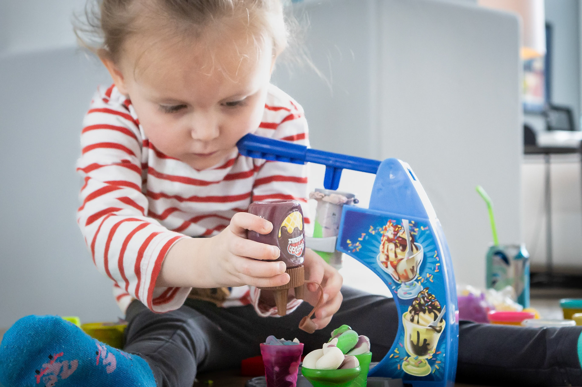 Concocting some delectible treats in the Play-Doh kitchen