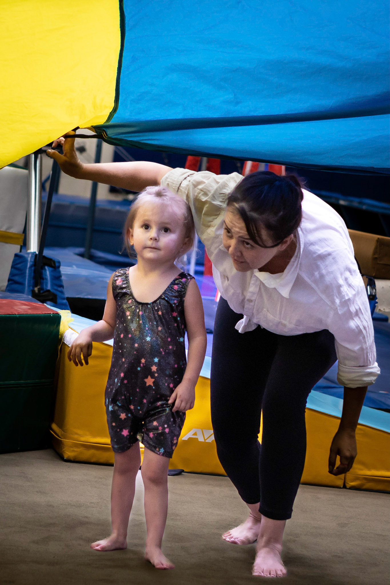 Taking stock of the parachute with Mom in gymnastics class