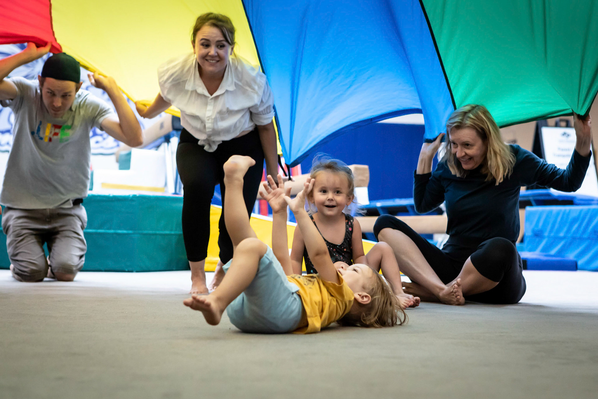 Under the parachute in gymnastics class