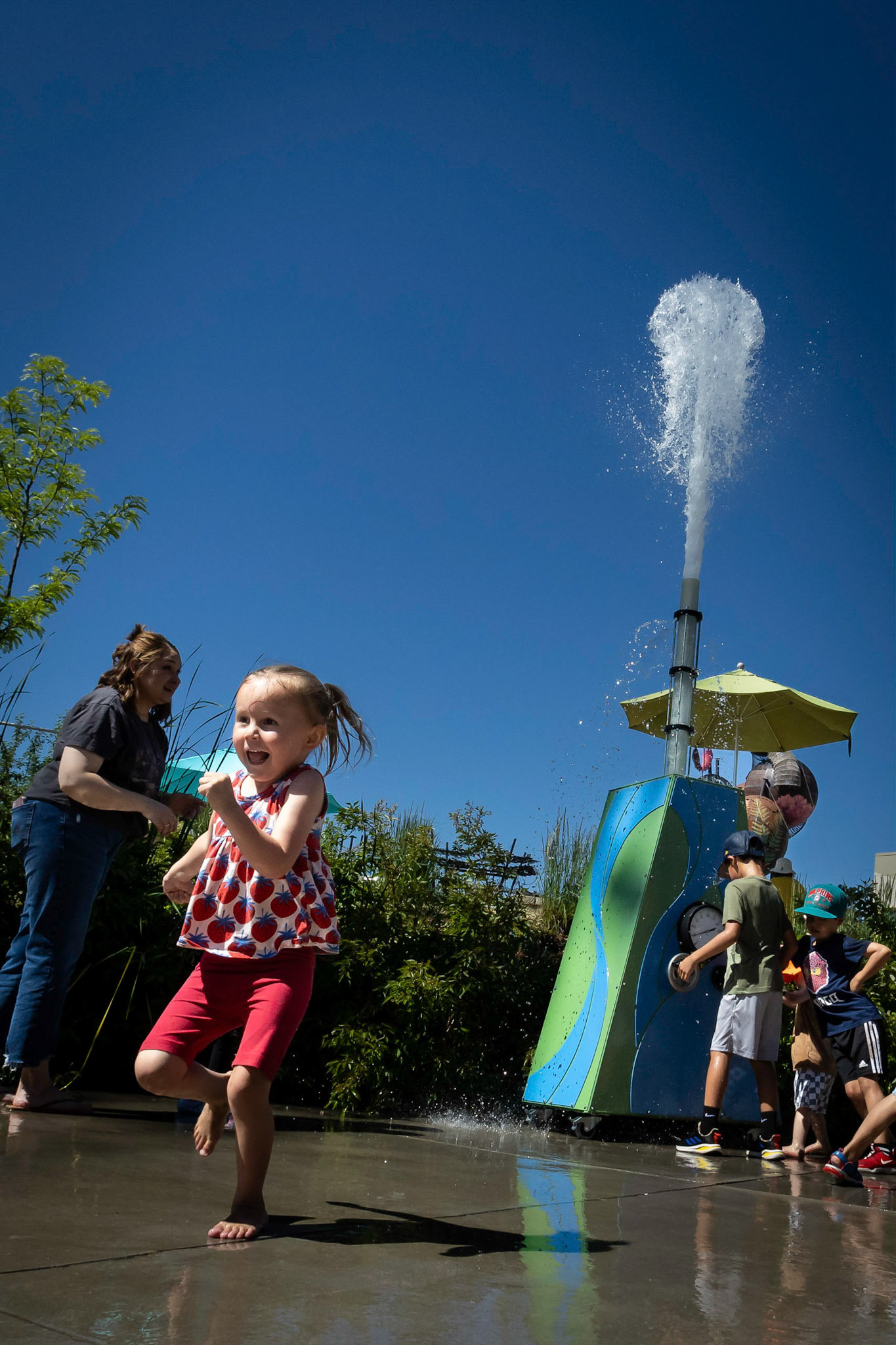 Outrunning, or trying to, the water cannon at Children's Museum