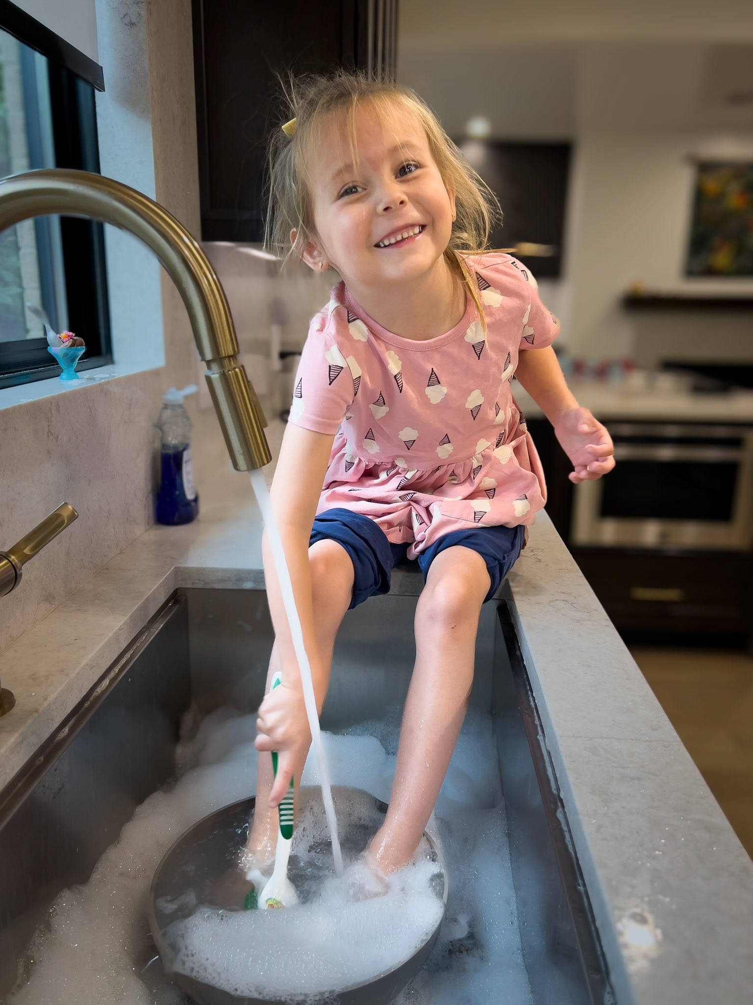 Finishing a kitchen cleanup with a little foot bath