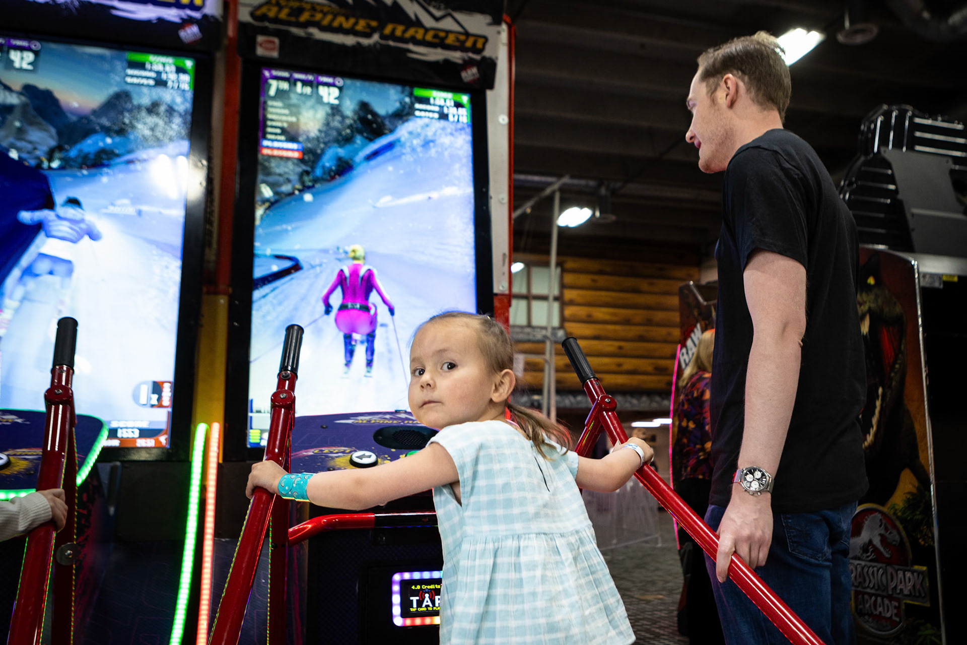 Playing the downhill ski racer game at Family Sports Center with Uncle E