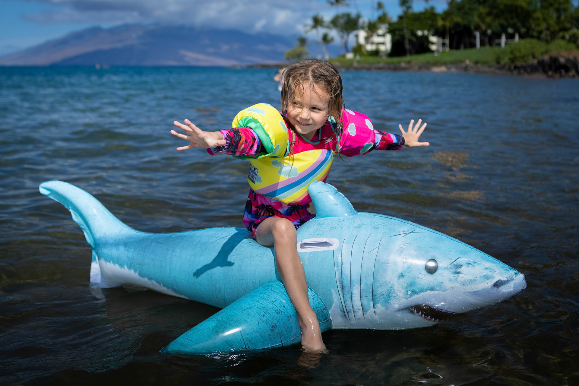 Staing atop the shark with no hands is harder than it looks