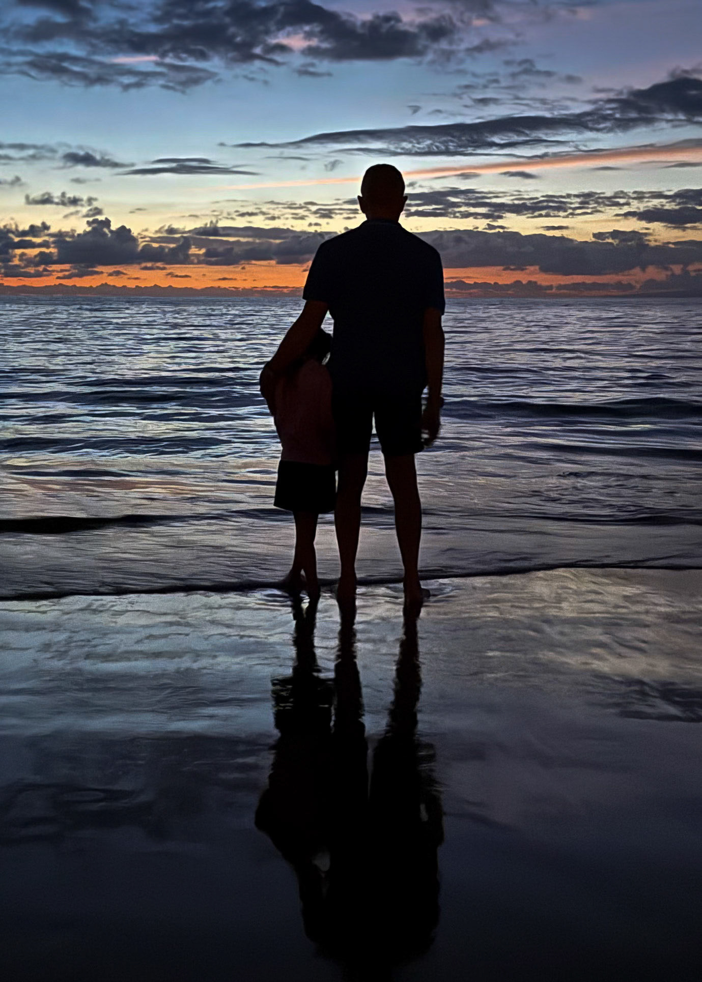Taking in the Maui sunset with Grandpa on the beach at Grand Wailea