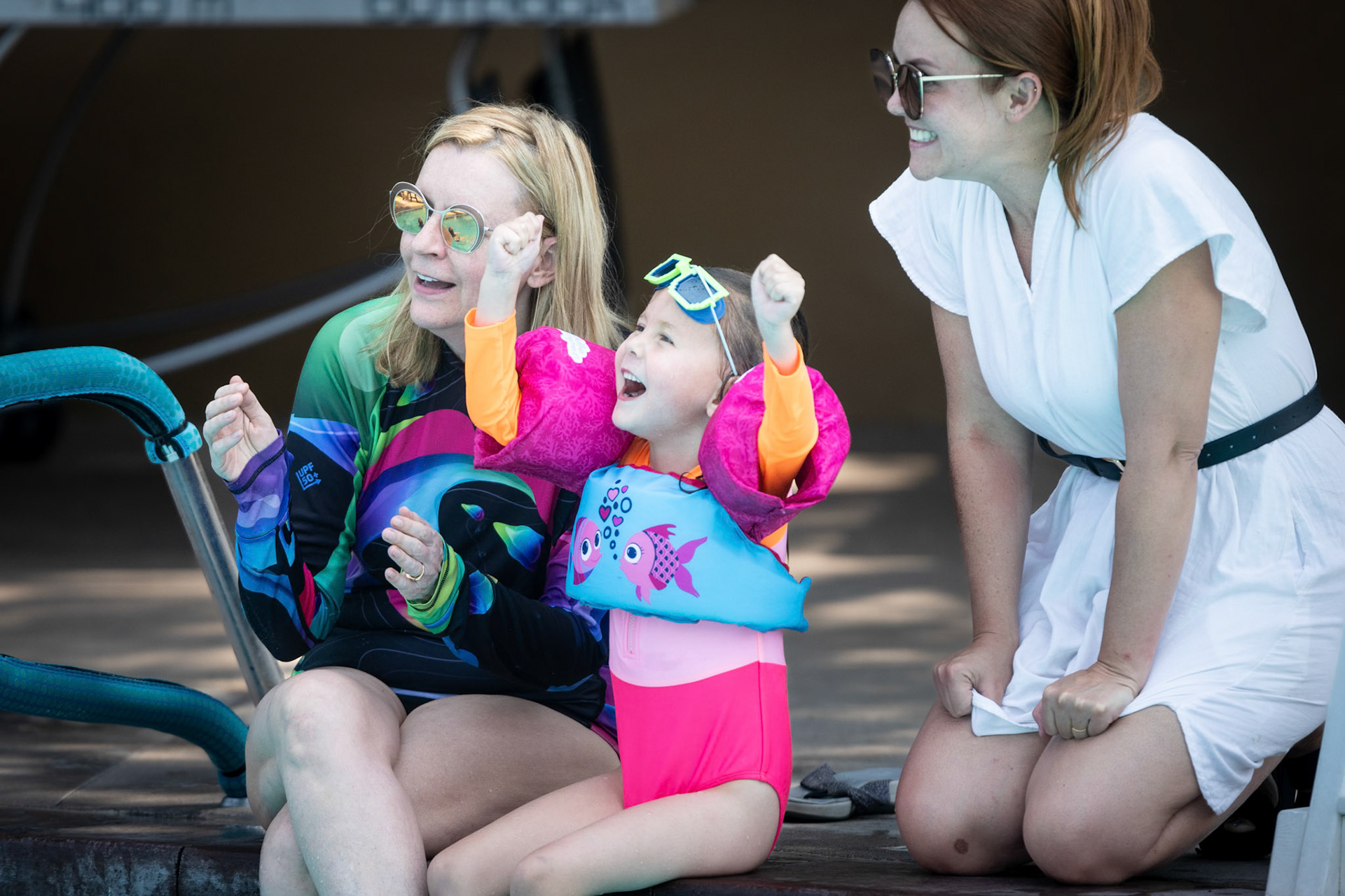 Cheering Dad on as he attempts a backflip off the diving board