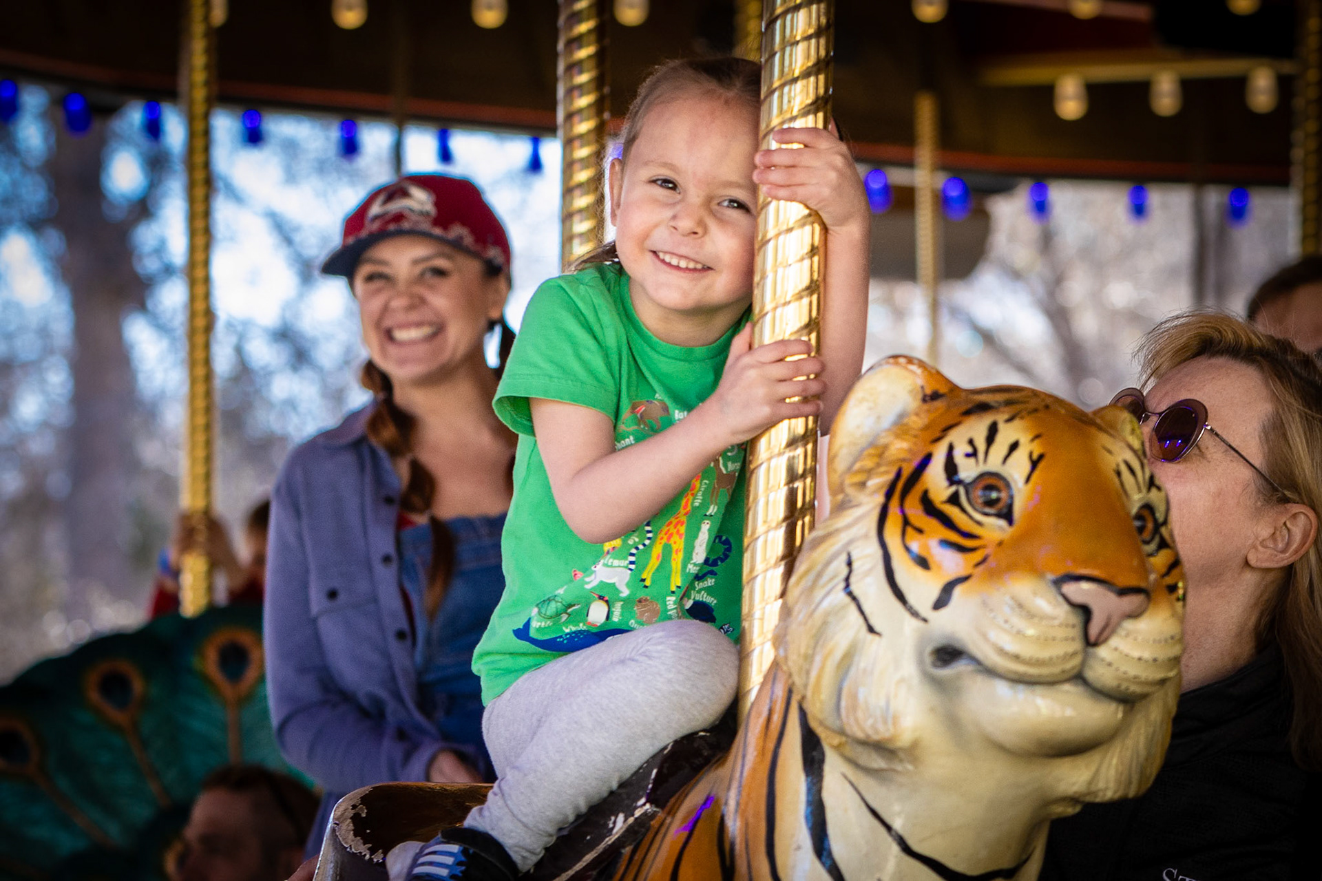 A  spin on the carousel with Mom and Mimi at the Denver Zoo