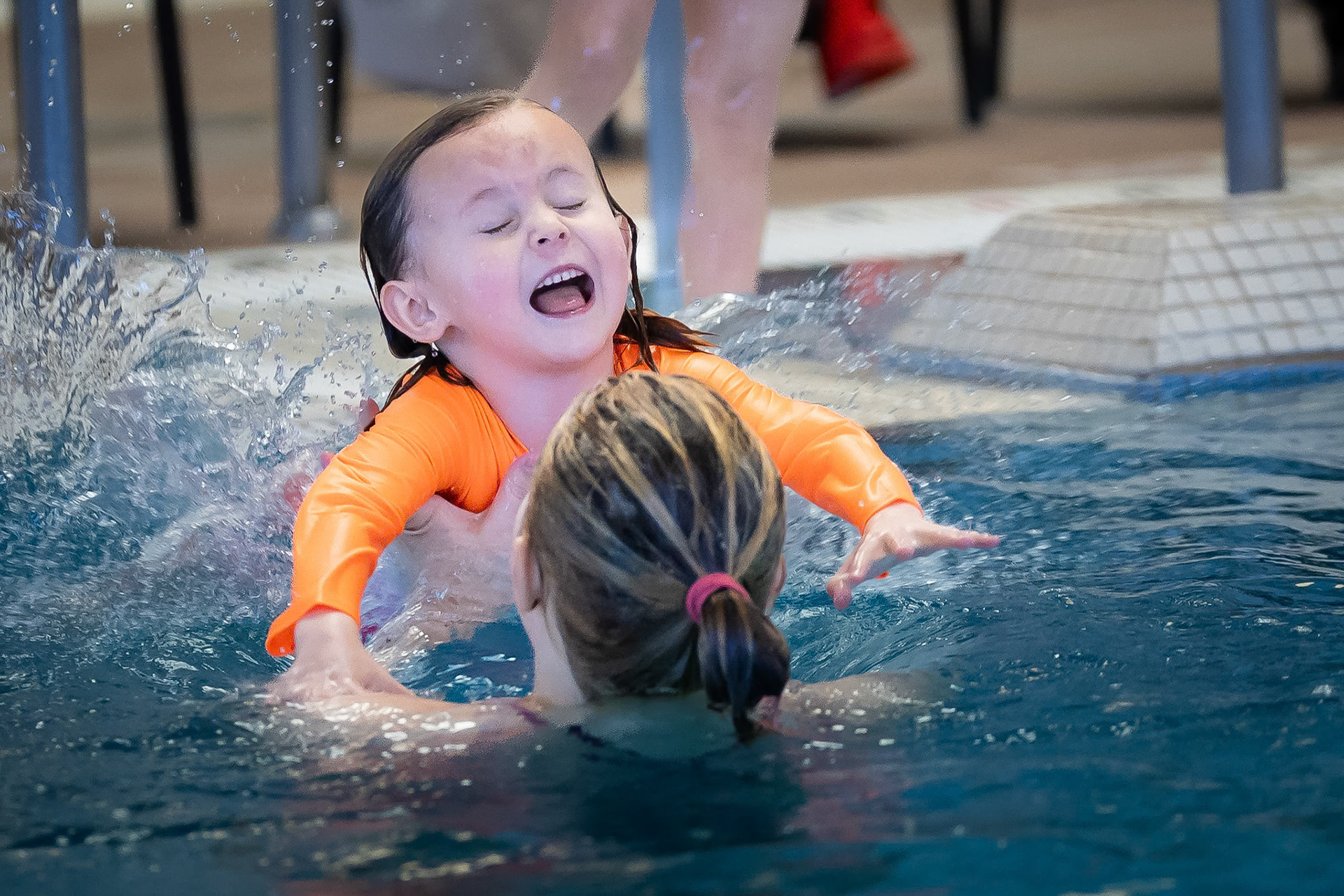 Taking the plunge during a swim lesson at Buck Recreation Center