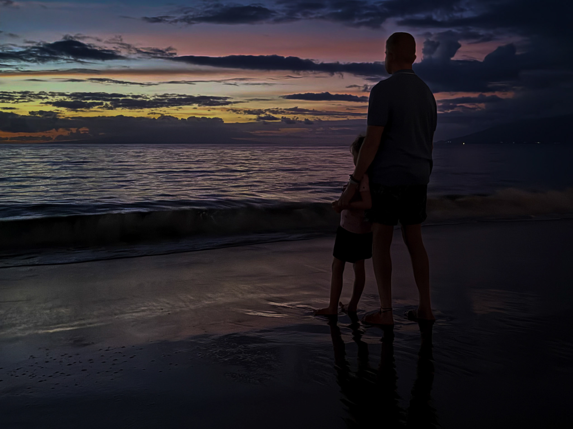 Taking in the Maui sunset with Grandpa on the beach at Grand Wailea