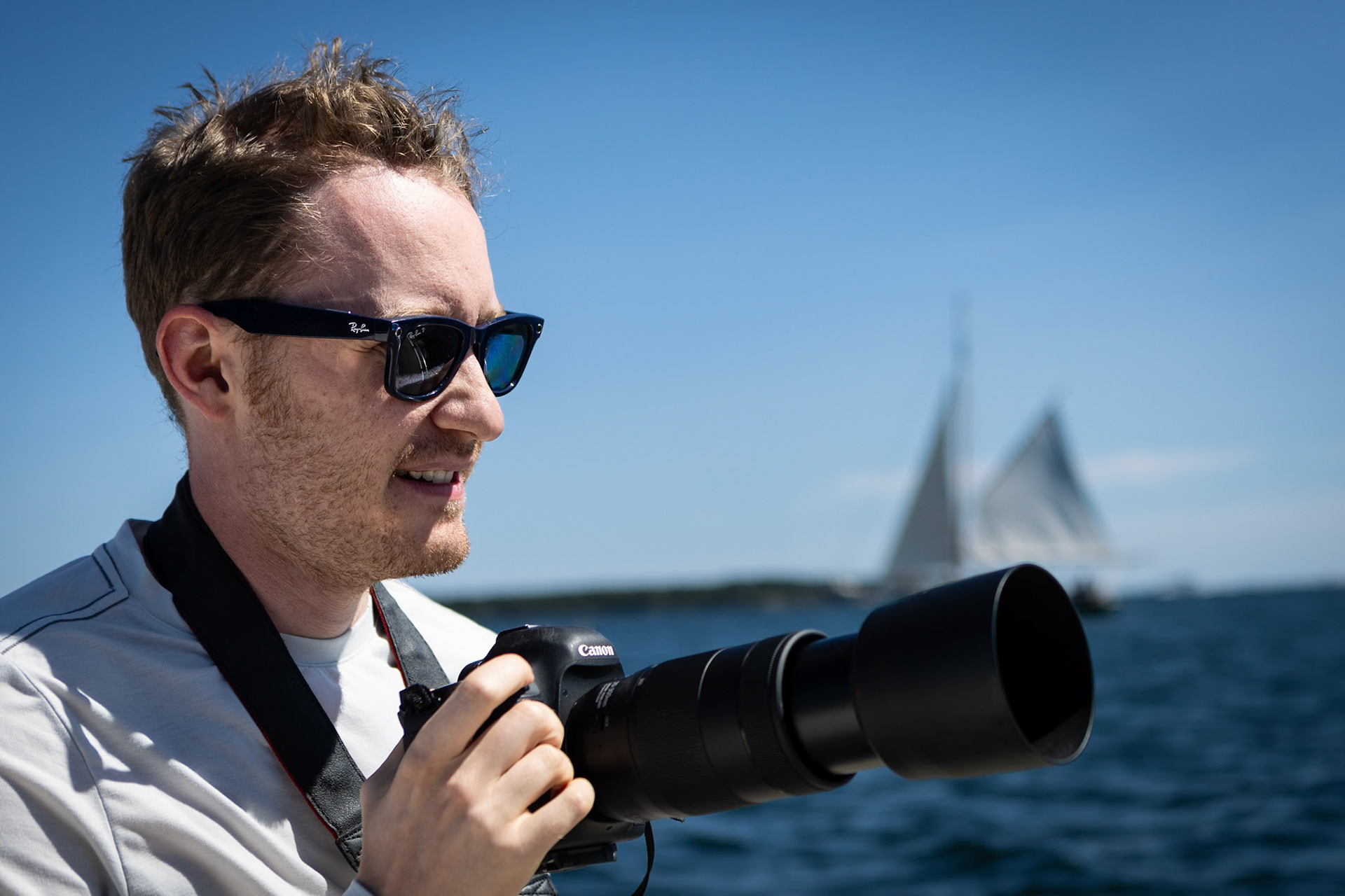 Photographing the sights during a harbor cruise in Maine
