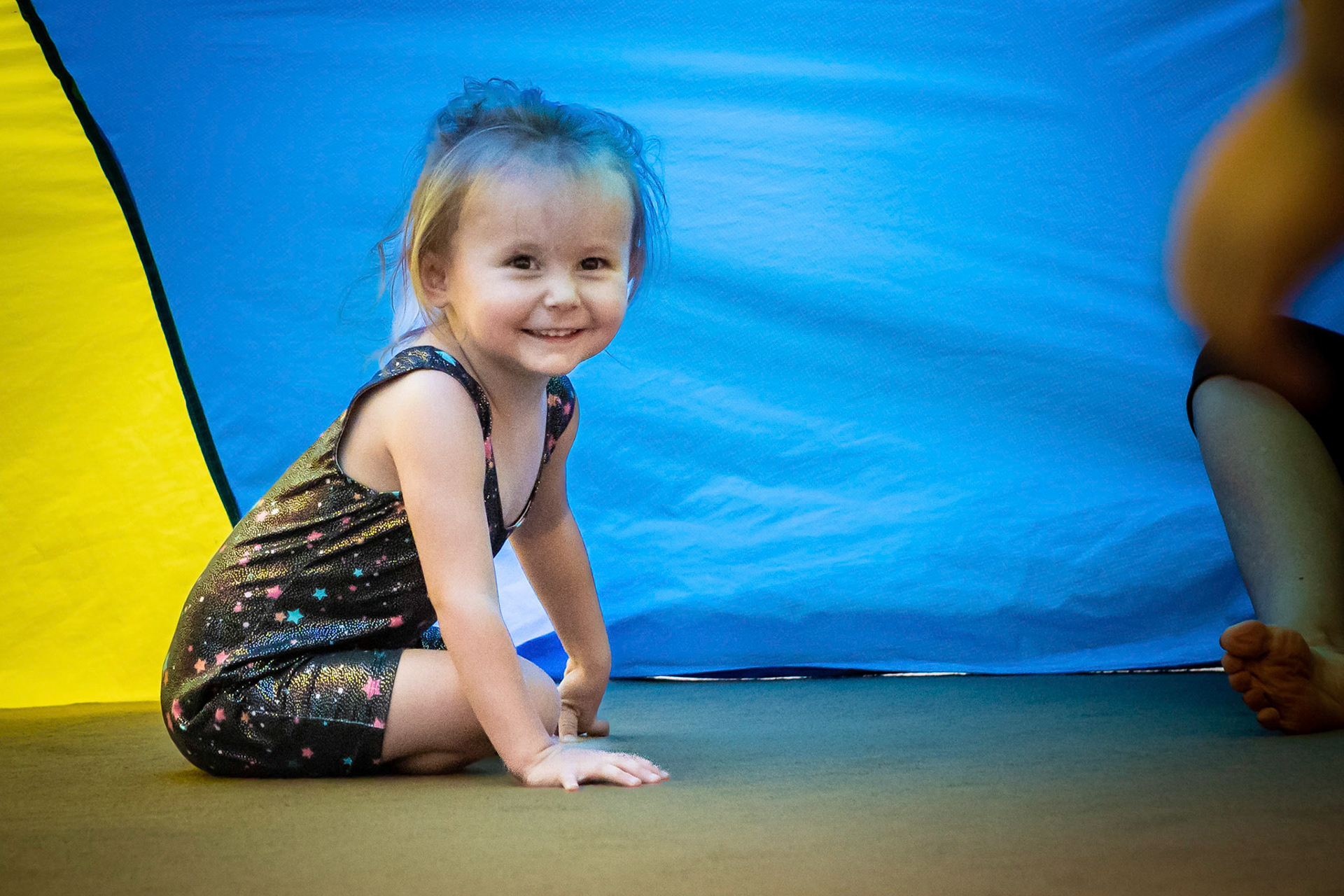 Under the parachute in gymnastics class