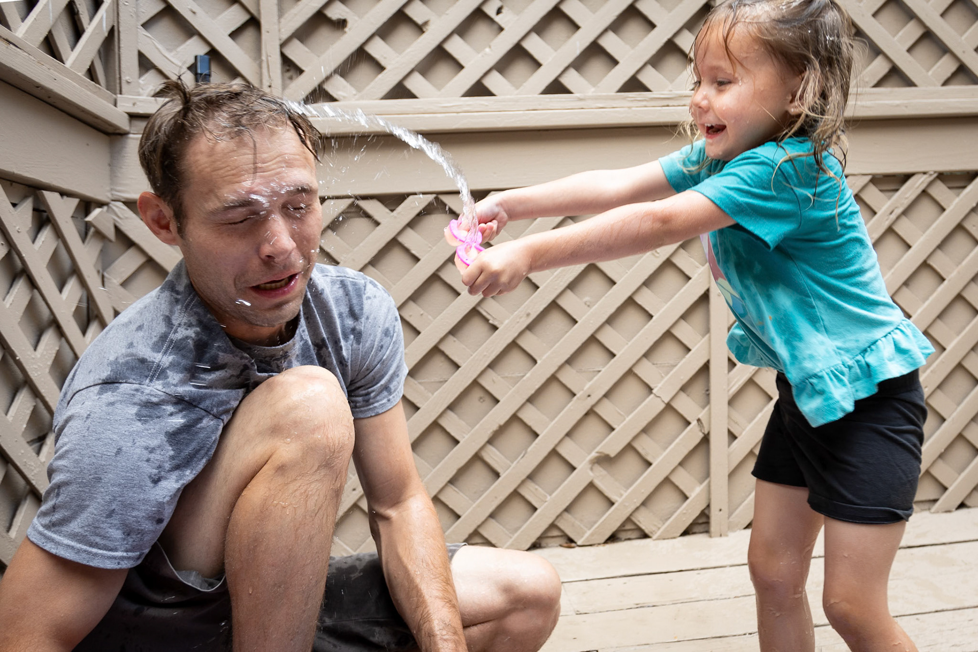 Playing water toys with Dad
