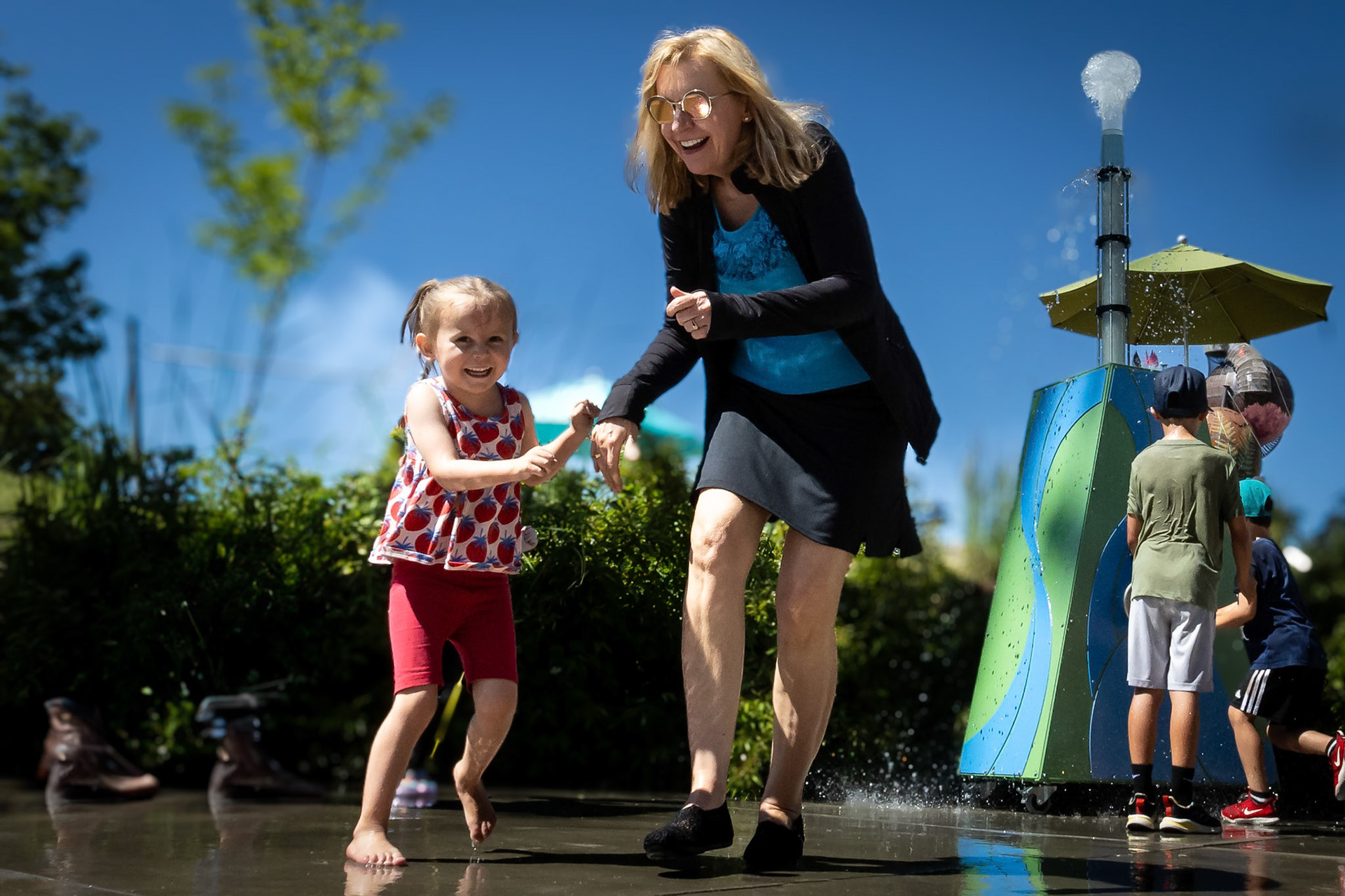 Enjoying the water cannon at Children's Museum with Mimi