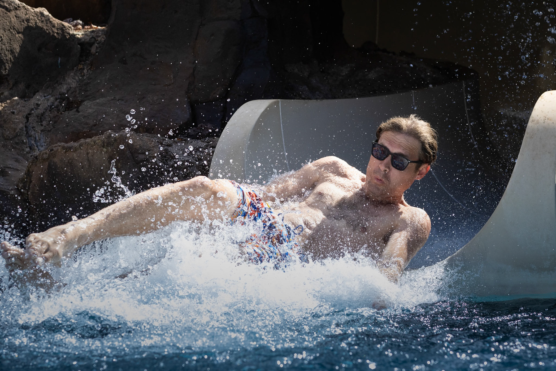 Dad takes a plunge down the aptly named Puka slide at Grand Wailea