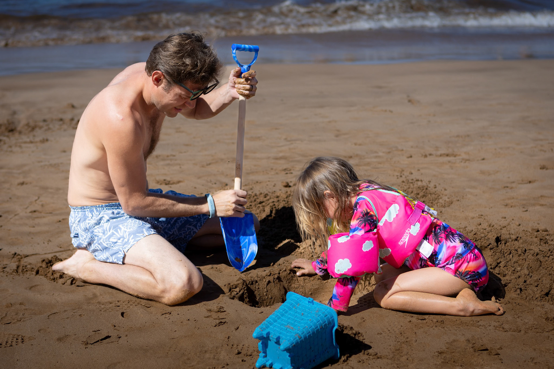 Digging for water with Dad on the beach at Grand Wailea