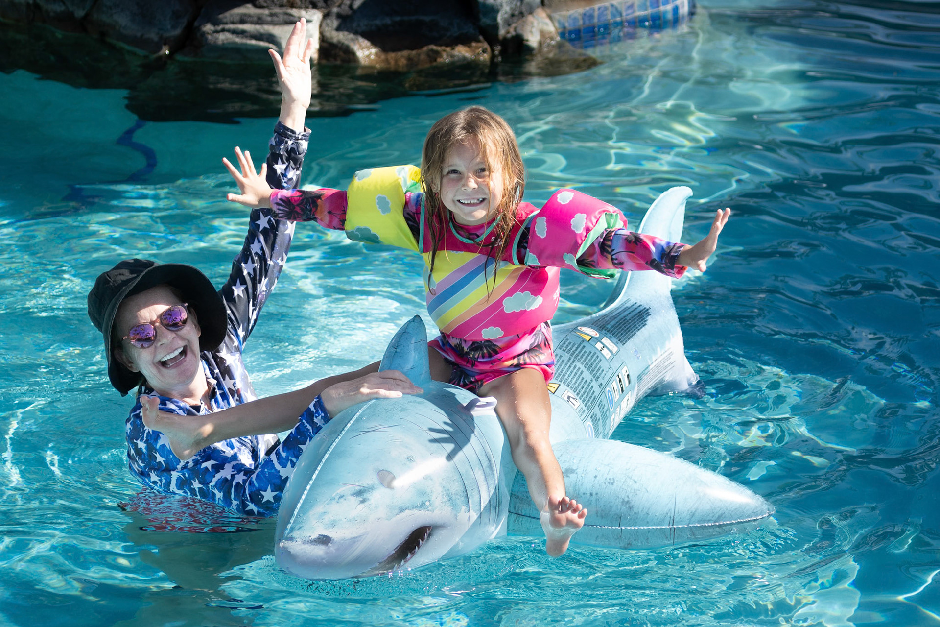 Staing atop the shark with no hands is harder than it looks