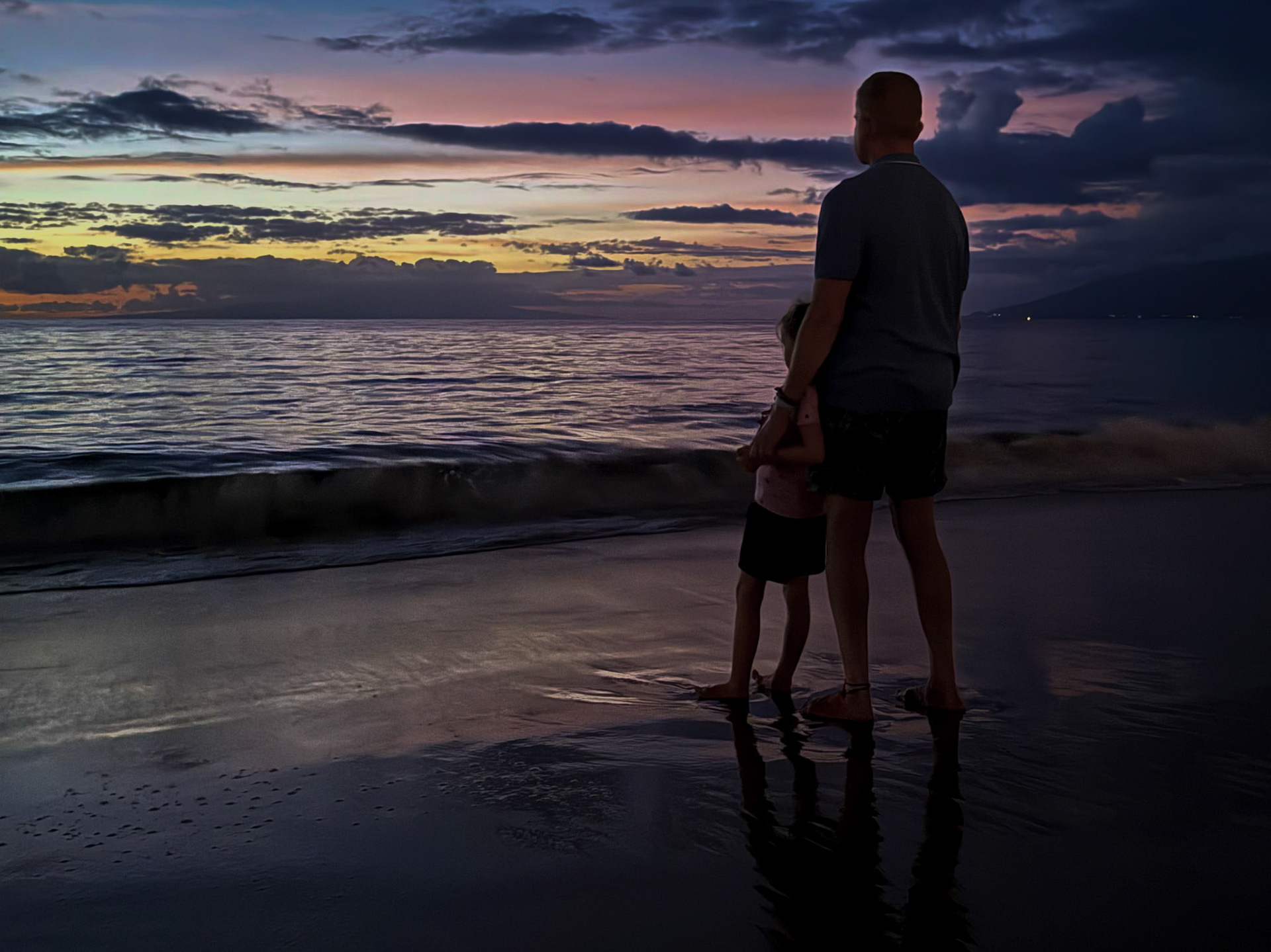 Taking in the Maui sunset with Grandpa on the beach at Grand Wailea
